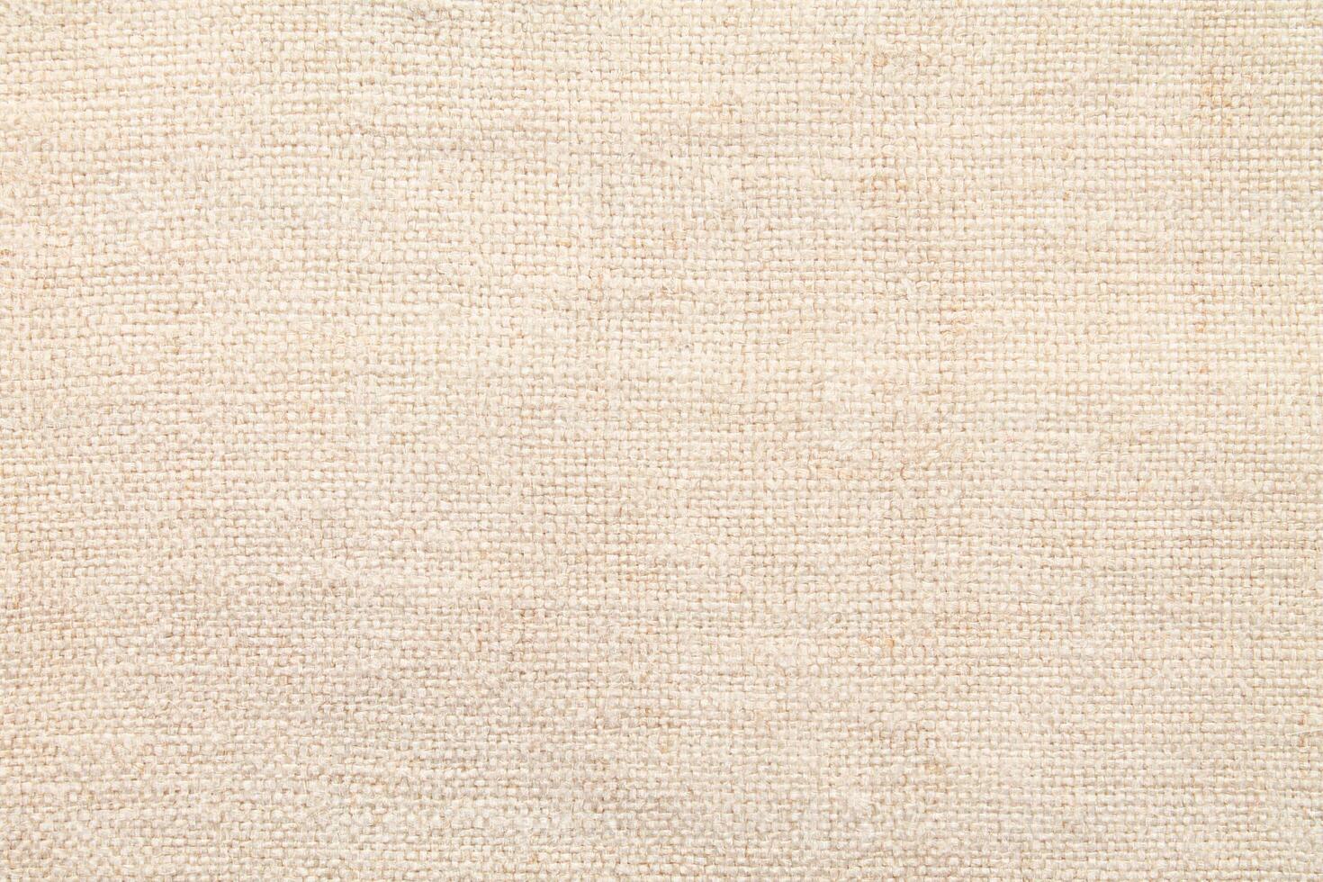 Natural Linen Material Textile Canvas Fabric Texture Background Close-up Detail of Fabric Natural Color Hemp Material Pattern Design Wallpaper. Can be Used as Background or For Graphic Design photo