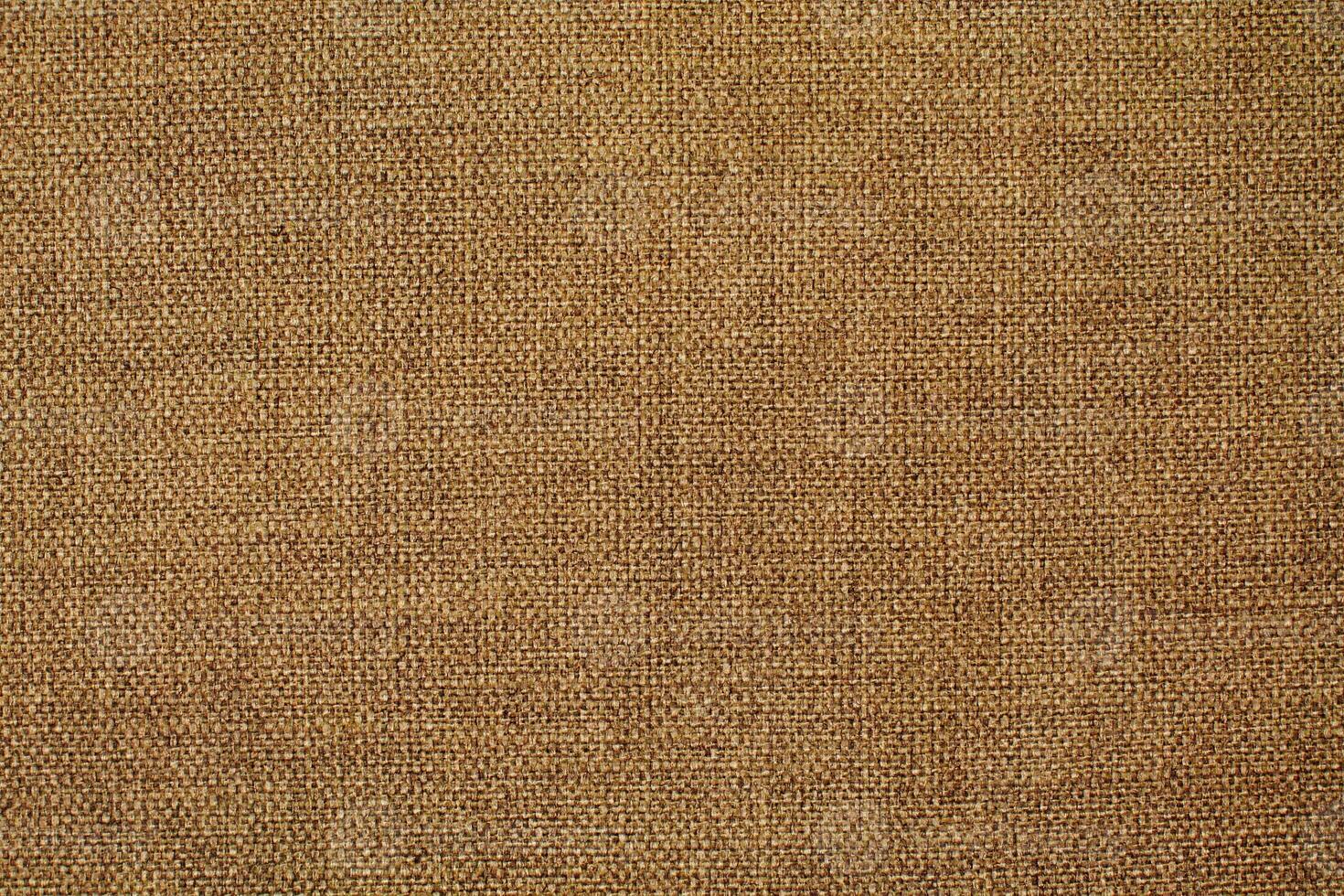 Natural Linen Material Textile Canvas Fabric Texture Background Close-up Detail of Fabric Natural Color Hemp Material Pattern Design Wallpaper. Can be Used as Background or For Graphic Design photo