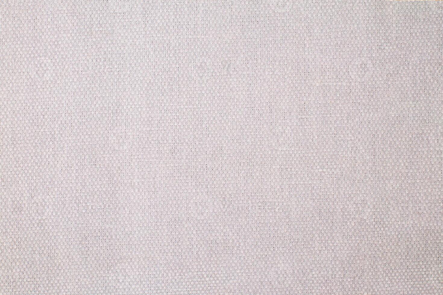 Natural Linen Material Textile Canvas Fabric Texture Background Close-up Detail of Fabric Natural Color Hemp Material Pattern Design Wallpaper. Can be Used as Background or For Graphic Design photo