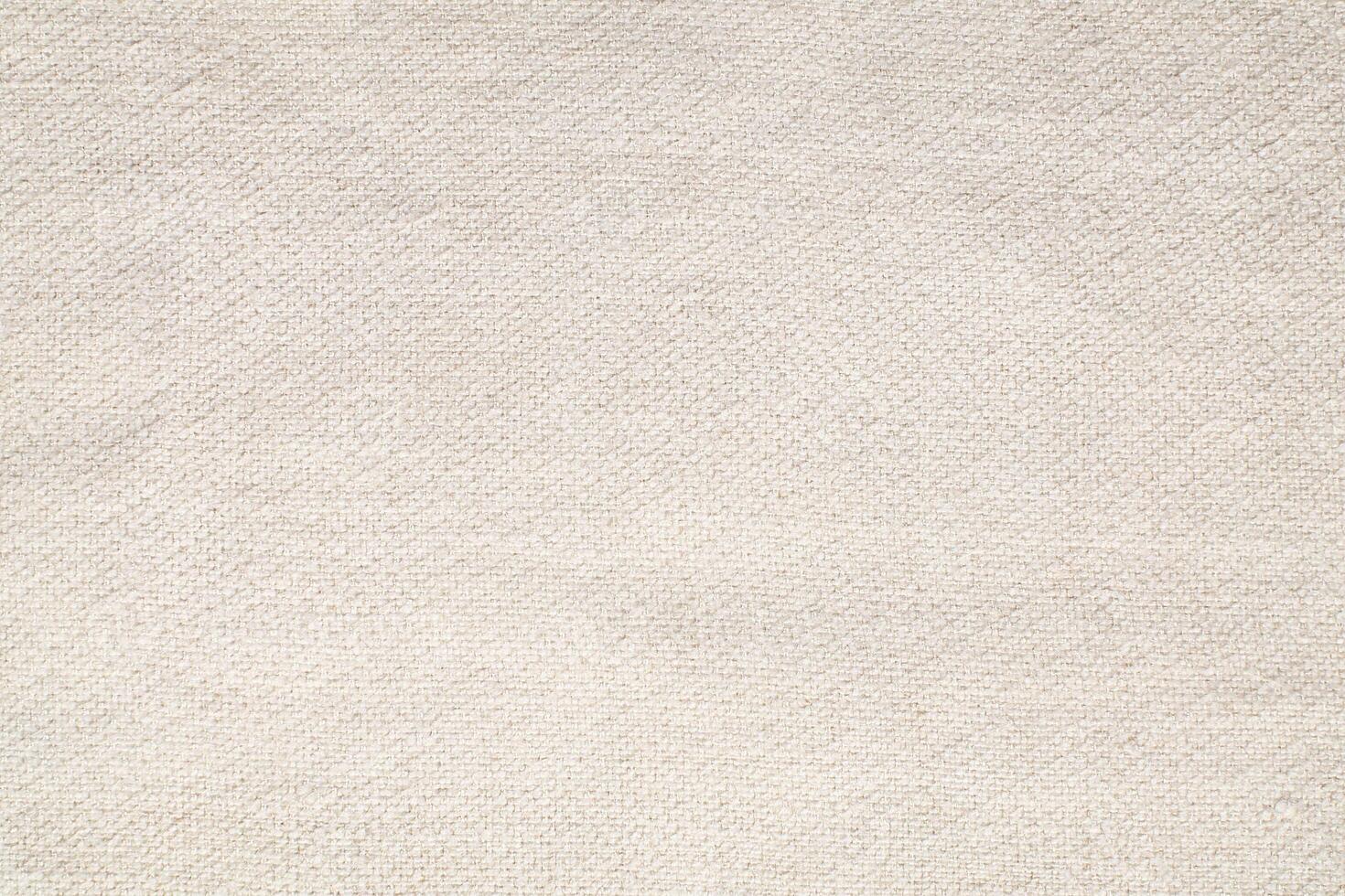 Natural Linen Material Textile Canvas Fabric Texture Background Close-up Detail of Fabric Natural Color Hemp Material Pattern Design Wallpaper. Can be Used as Background or For Graphic Design photo
