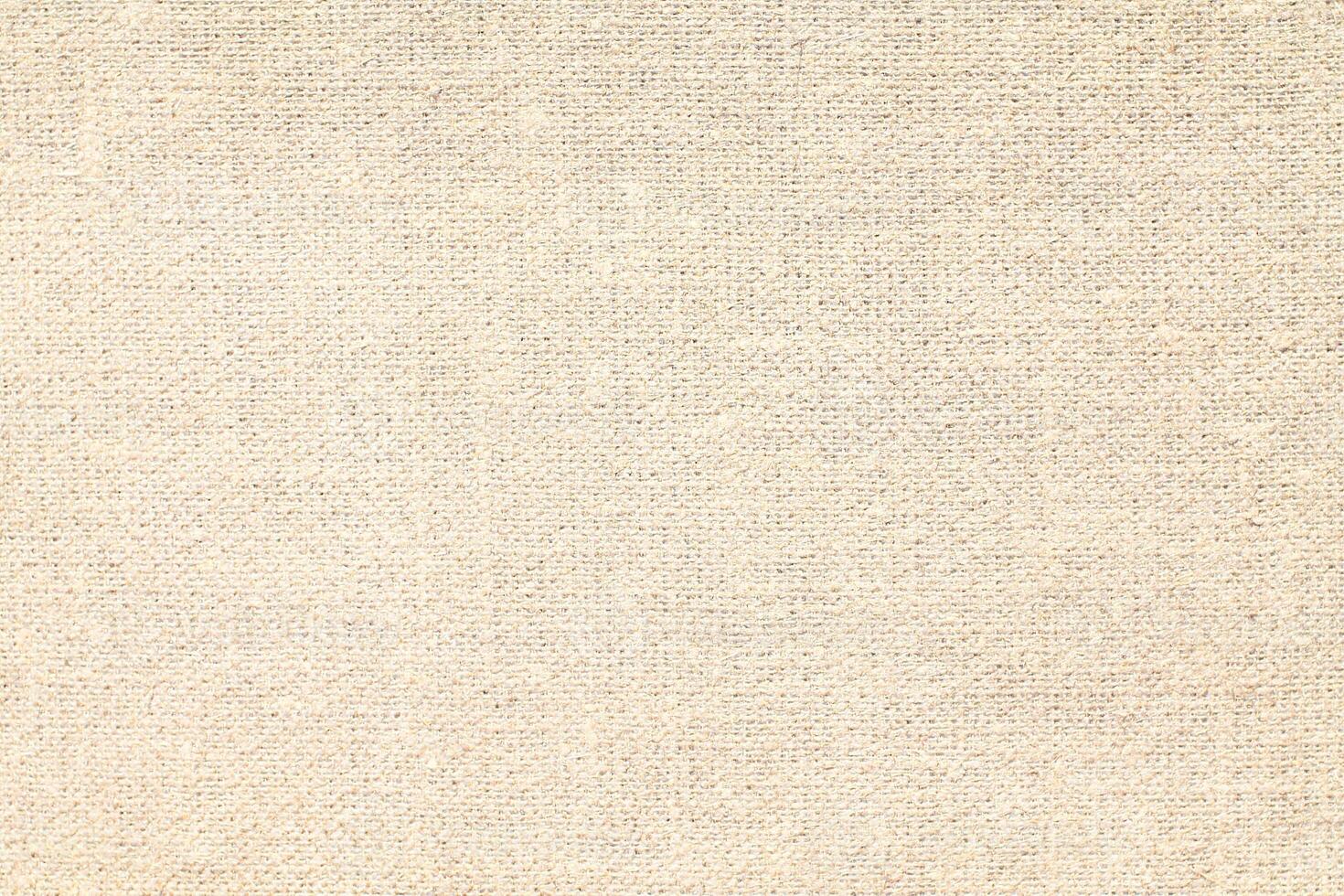 Natural Linen Material Textile Canvas Fabric Texture Background Close-up Detail of Fabric Natural Color Hemp Material Pattern Design Wallpaper. Can be Used as Background or For Graphic Design photo