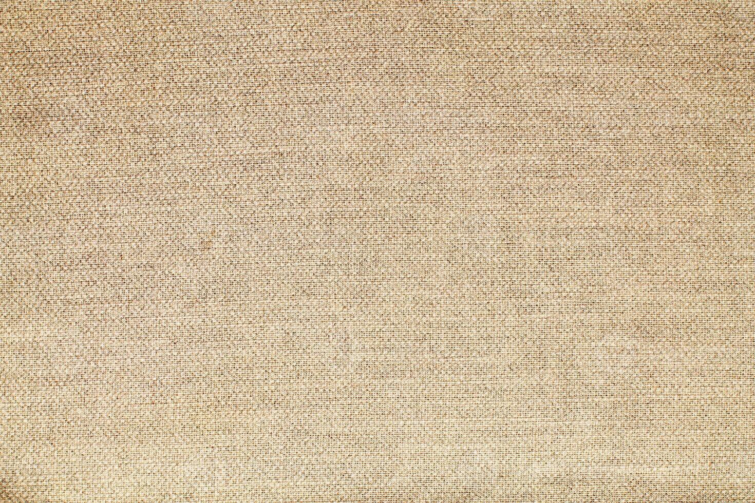 Natural Linen Material Textile Canvas Fabric Texture Background Close-up Detail of Fabric Natural Color Hemp Material Pattern Design Wallpaper. Can be Used as Background or For Graphic Design photo