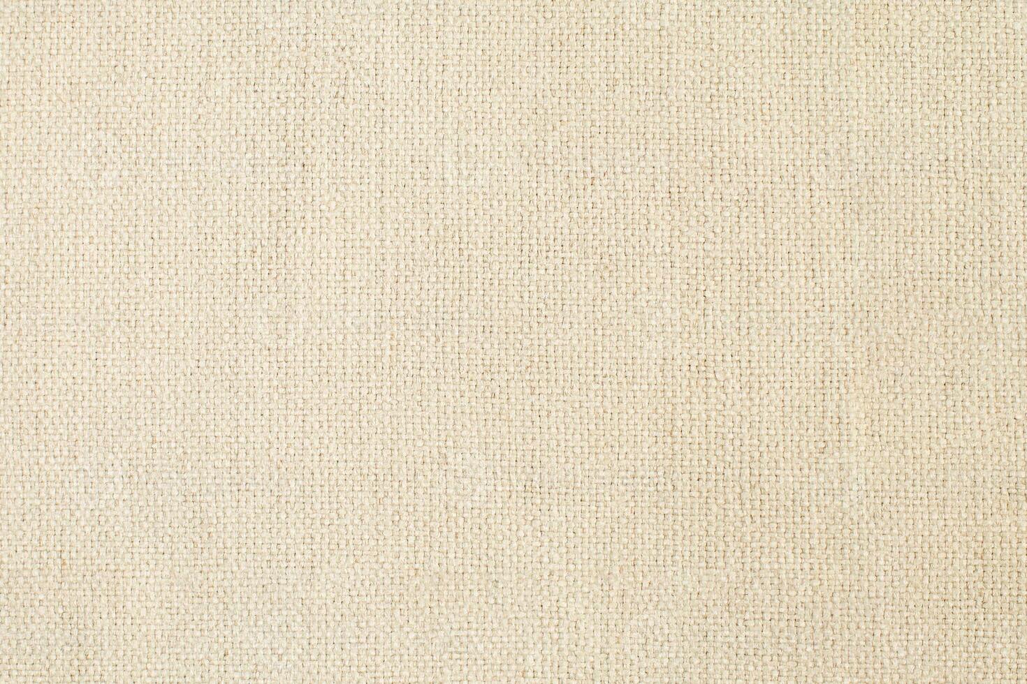 Natural Linen Material Textile Canvas Fabric Texture Background Close-up Detail of Fabric Natural Color Hemp Material Pattern Design Wallpaper. Can be Used as Background or For Graphic Design photo