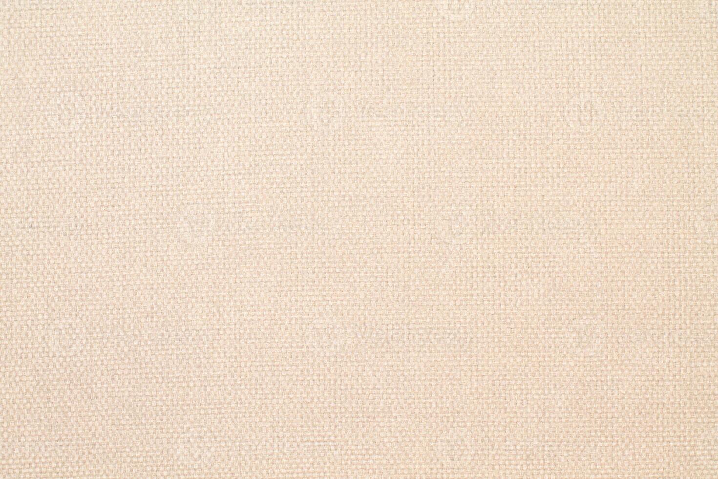Natural Linen Material Textile Canvas Fabric Texture Background Close-up Detail of Fabric Natural Color Hemp Material Pattern Design Wallpaper. Can be Used as Background or For Graphic Design photo