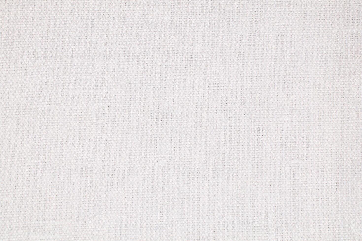 Natural Linen Material Textile Canvas Fabric Texture Background Close-up Detail of Fabric Natural Color Hemp Material Pattern Design Wallpaper. Can be Used as Background or For Graphic Design photo