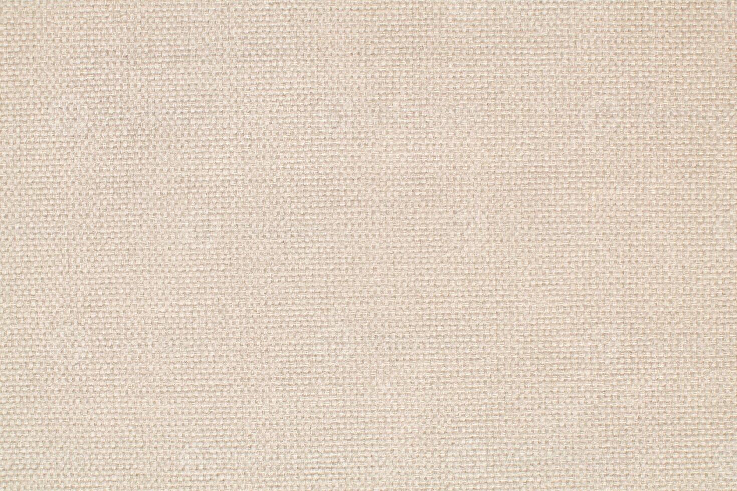 Natural Linen Material Textile Canvas Fabric Texture Background Close-up Detail of Fabric Natural Color Hemp Material Pattern Design Wallpaper. Can be Used as Background or For Graphic Design photo