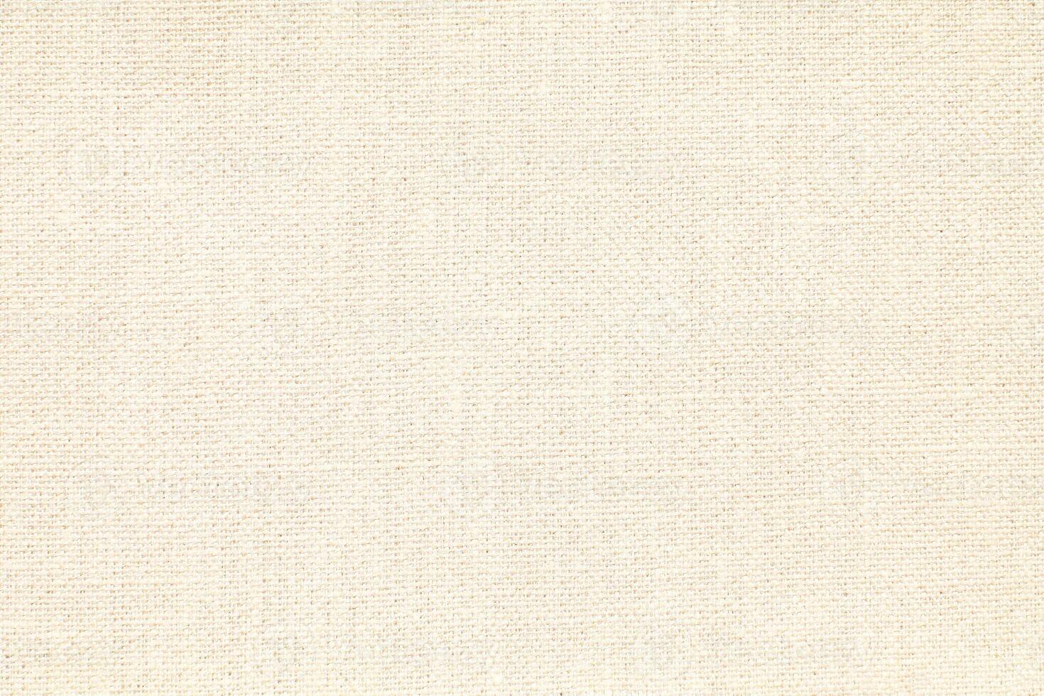 Natural Linen Material Textile Canvas Fabric Texture Background Close-up Detail of Fabric Natural Color Hemp Material Pattern Design Wallpaper. Can be Used as Background or For Graphic Design photo
