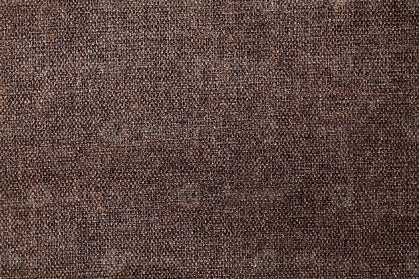 Natural Linen Material Textile Canvas Fabric Texture Background Close-up Detail of Fabric Natural Color Hemp Material Pattern Design Wallpaper. Can be Used as Background or For Graphic Design photo