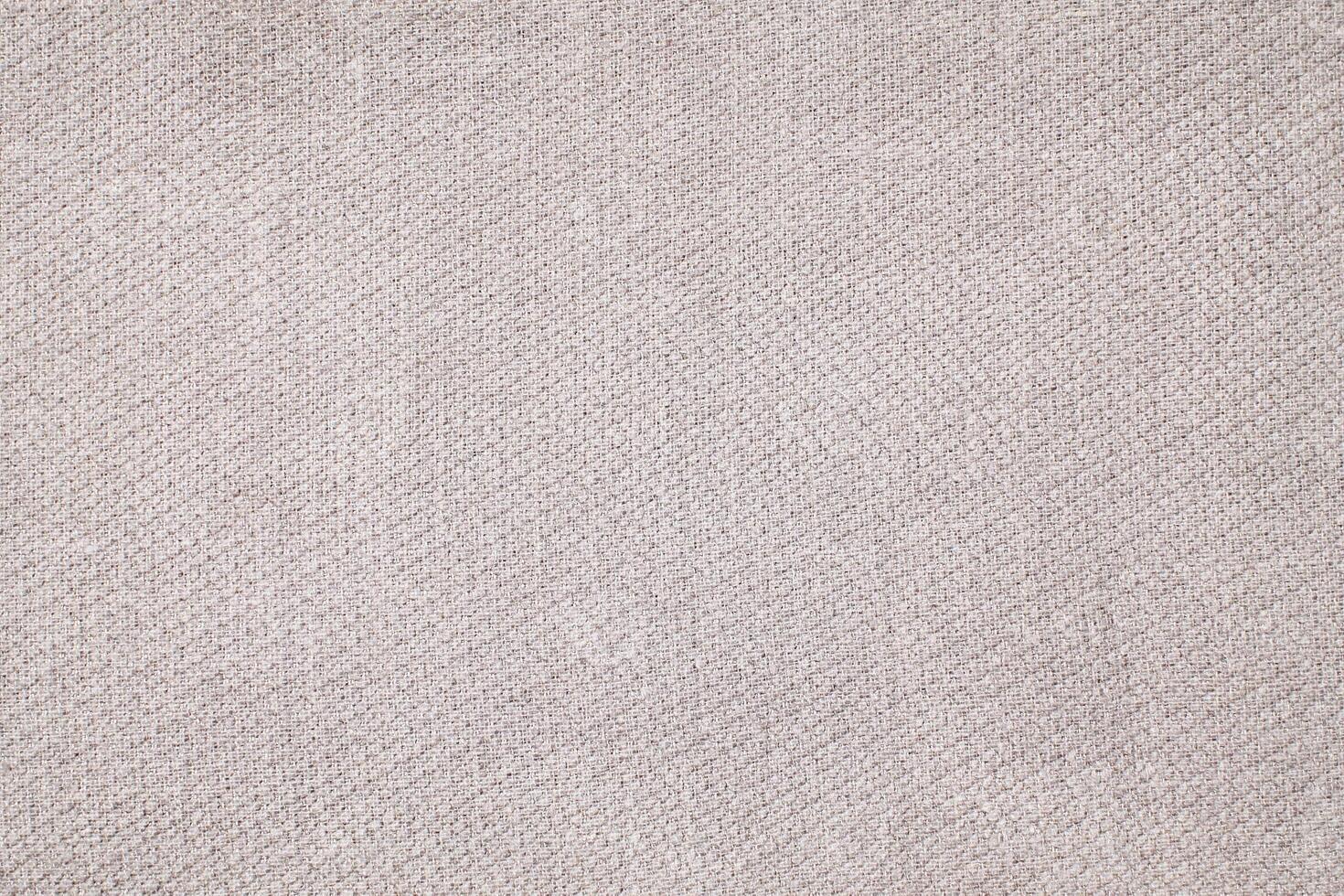 Natural Linen Material Textile Canvas Fabric Texture Background Close-up Detail of Fabric Natural Color Hemp Material Pattern Design Wallpaper. Can be Used as Background or For Graphic Design photo