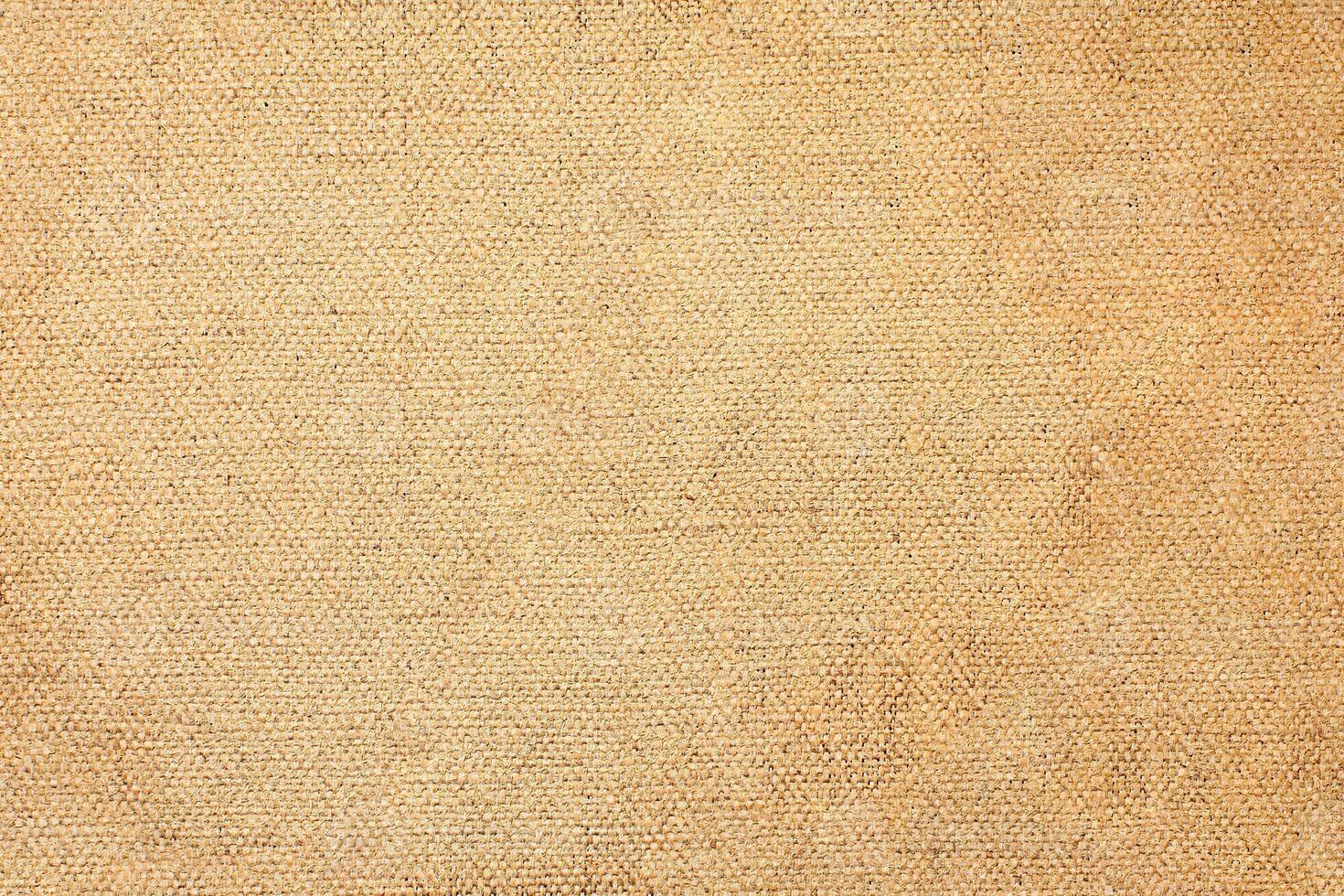 Natural Linen Material Textile Canvas Fabric Texture Background Close-up Detail of Fabric Natural Color Hemp Material Pattern Design Wallpaper. Can be Used as Background or For Graphic Design photo