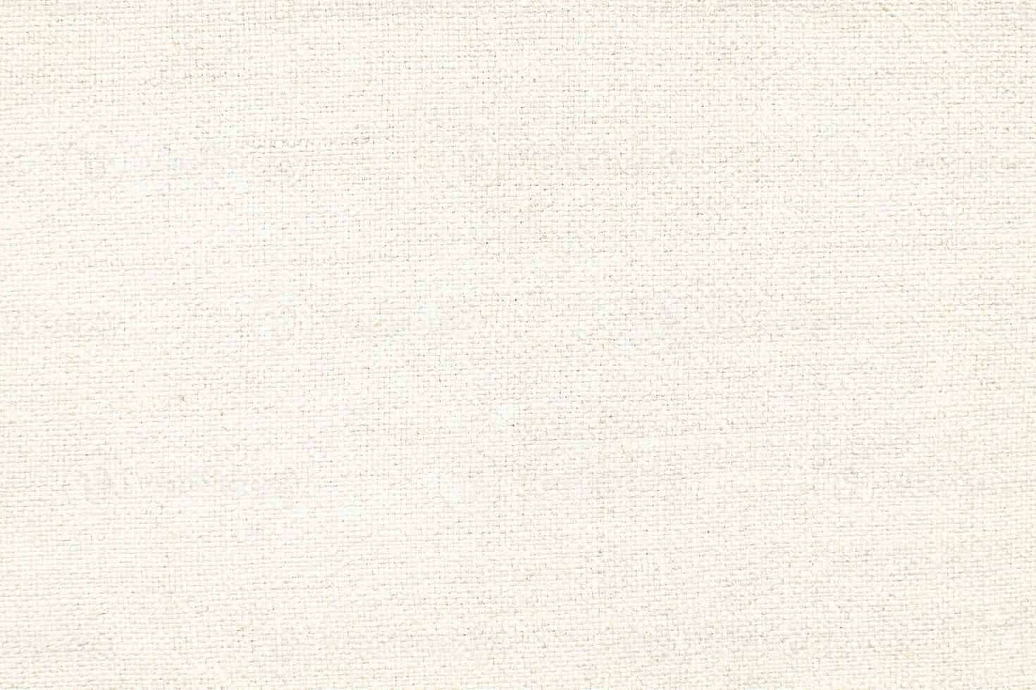 Natural Linen Material Textile Canvas Fabric Texture Background Close-up Detail of Fabric Natural Color Hemp Material Pattern Design Wallpaper. Can be Used as Background or For Graphic Design photo