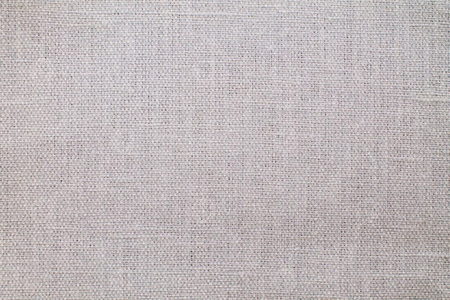 Natural Linen Material Textile Canvas Fabric Texture Background Close-up Detail of Fabric Natural Color Hemp Material Pattern Design Wallpaper. Can be Used as Background or For Graphic Design photo
