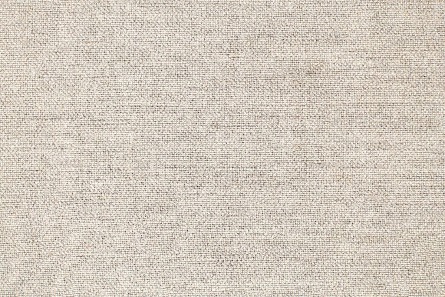 Natural Linen Material Textile Canvas Fabric Texture Background Close-up Detail of Fabric Natural Color Hemp Material Pattern Design Wallpaper. Can be Used as Background or For Graphic Design photo
