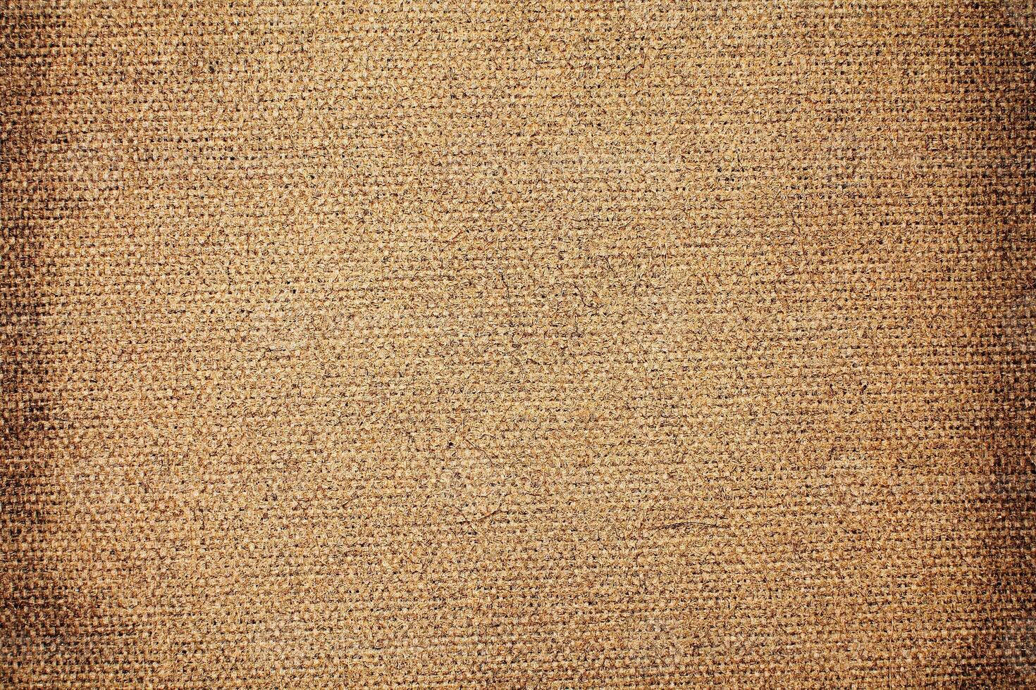 Natural Linen Material Textile Canvas Fabric Texture Background Close-up Detail of Fabric Natural Color Hemp Material Pattern Design Wallpaper. Can be Used as Background or For Graphic Design photo