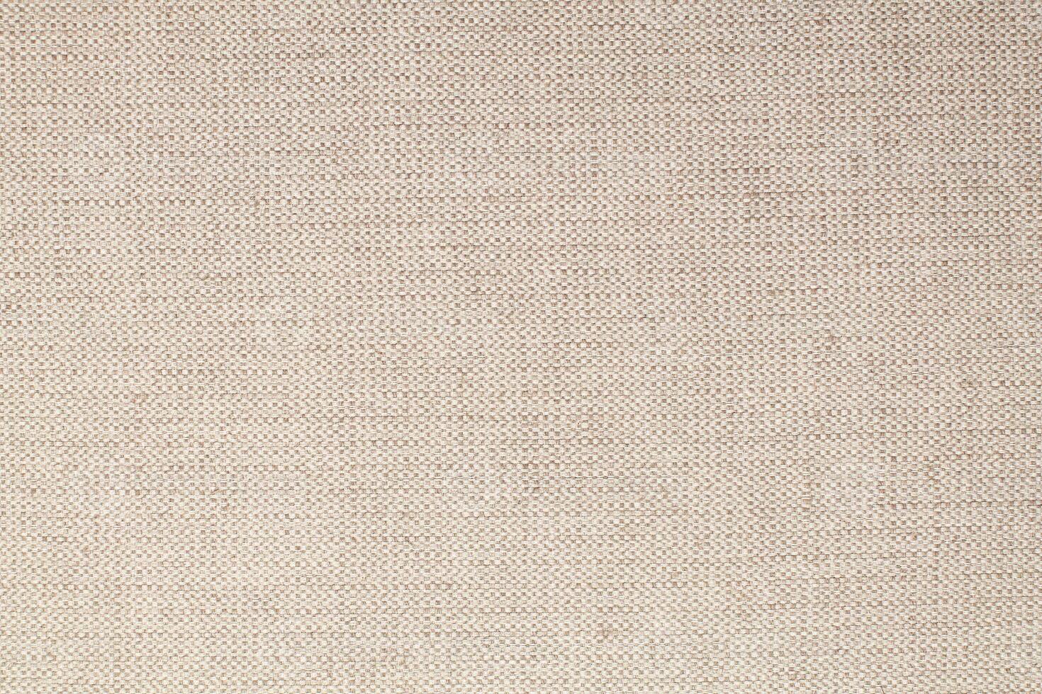 Natural Linen Material Textile Canvas Fabric Texture Background Close-up Detail of Fabric Natural Color Hemp Material Pattern Design Wallpaper. Can be Used as Background or For Graphic Design photo