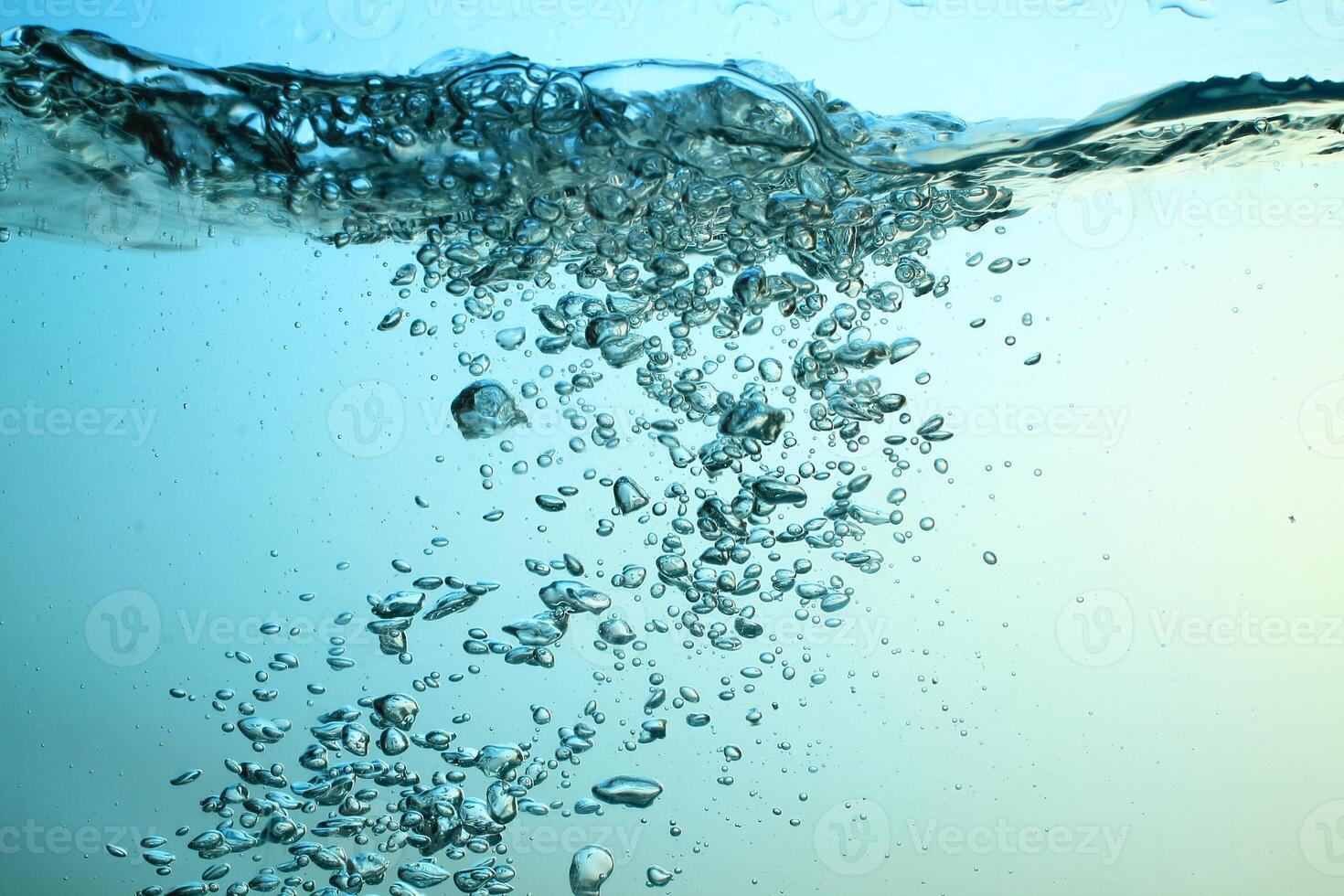 Fresh Water With Underwater Bubbles Texture on a Blue Background Close-up Abstract Liquid Bubbles Aqua Design Wallpaper photo