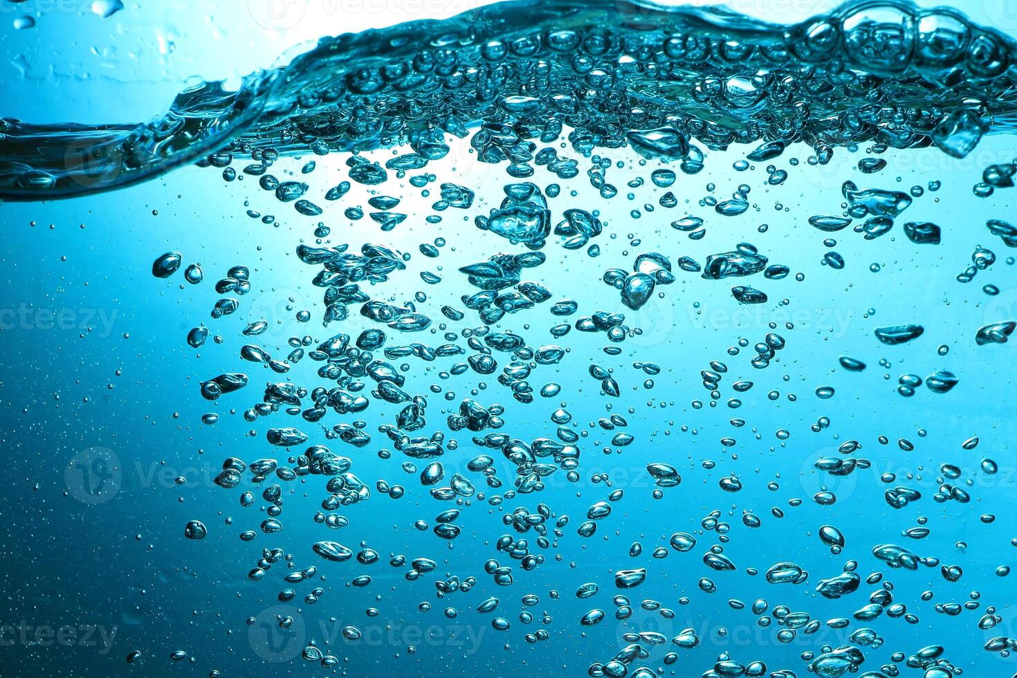 Fresh Water With Underwater Bubbles Texture on a Blue Background Close-up Abstract Liquid Bubbles Aqua Design Wallpaper photo