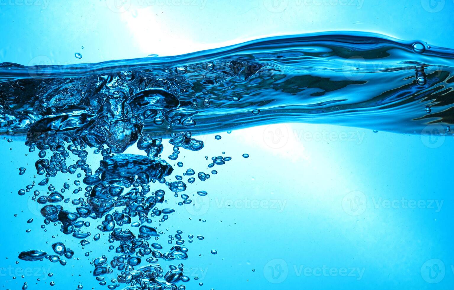 Fresh Water With Underwater Bubbles Texture on a Blue Background Close-up Abstract Liquid Bubbles Aqua Design Wallpaper photo