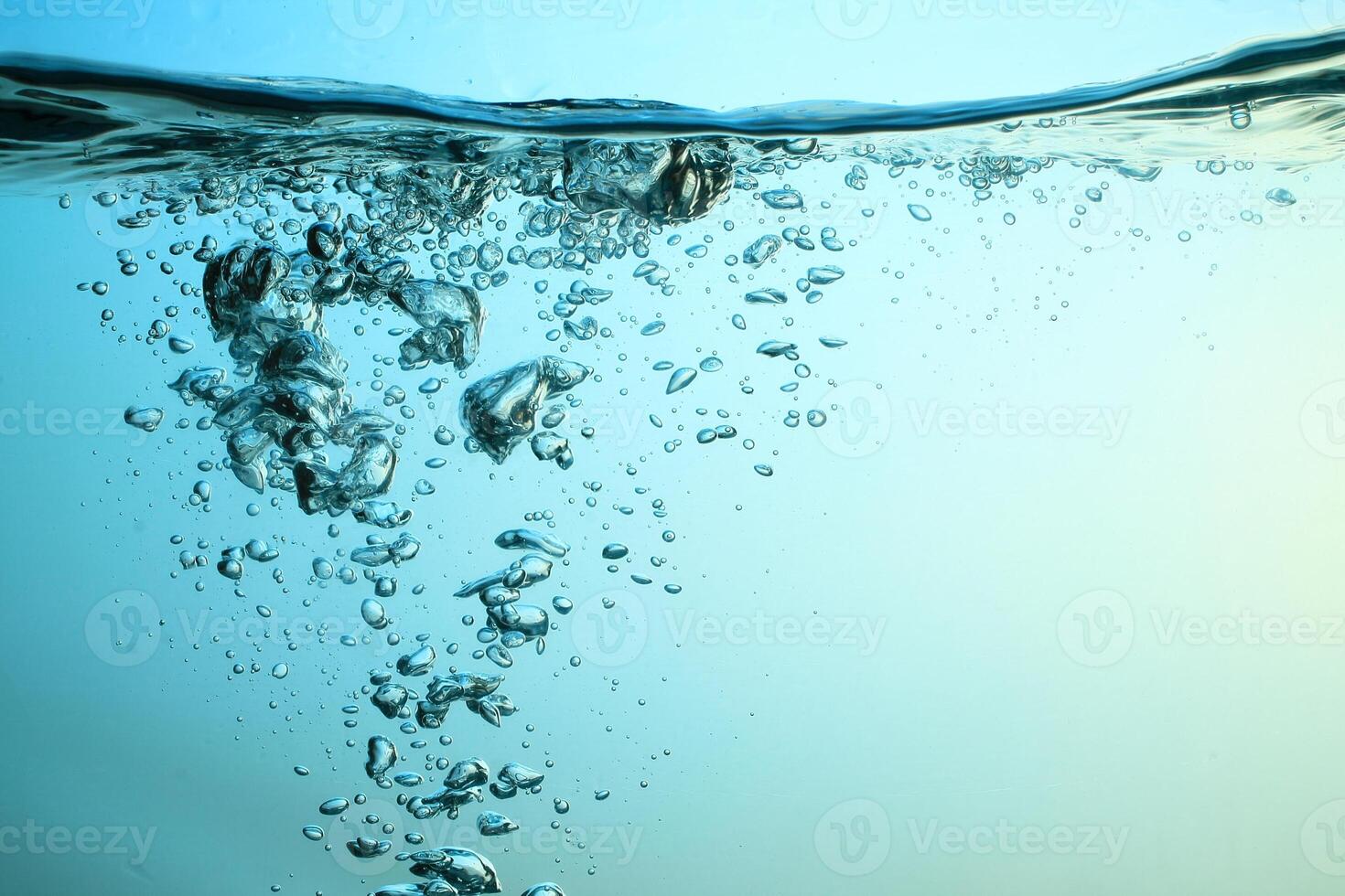 Fresh Water With Underwater Bubbles Texture on a Blue Background Close-up Abstract Liquid Bubbles Aqua Design Wallpaper photo