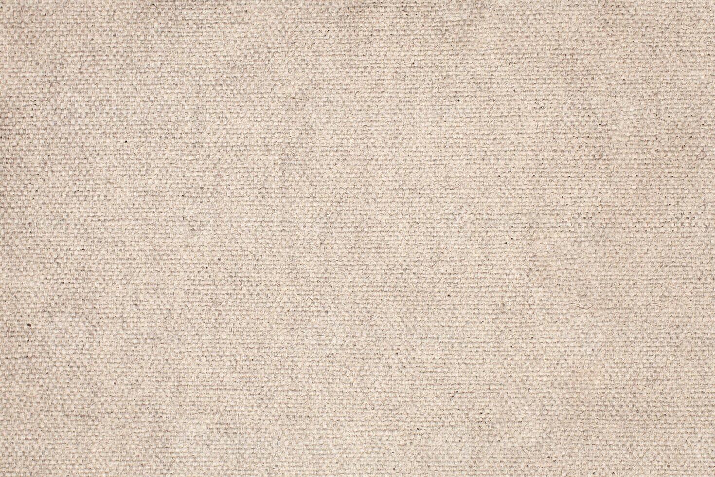 Natural Linen Material Textile Canvas Fabric Texture Background Close-up Detail of Fabric Natural Color Hemp Material Pattern Design Wallpaper. Can be Used as Background or For Graphic Design photo