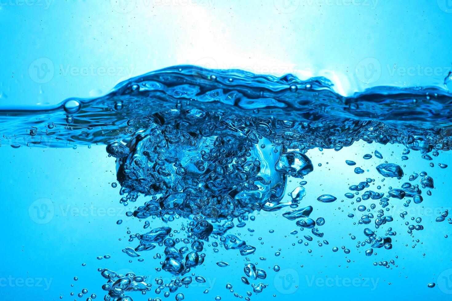 Fresh Water With Underwater Bubbles Texture on a Blue Background Close-up Abstract Liquid Bubbles Aqua Design Wallpaper photo