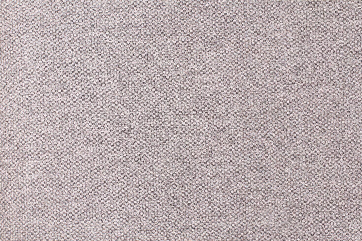 Natural Linen Material Textile Canvas Fabric Texture Background Close-up Detail of Fabric Natural Color Hemp Material Pattern Design Wallpaper. Can be Used as Background or For Graphic Design photo