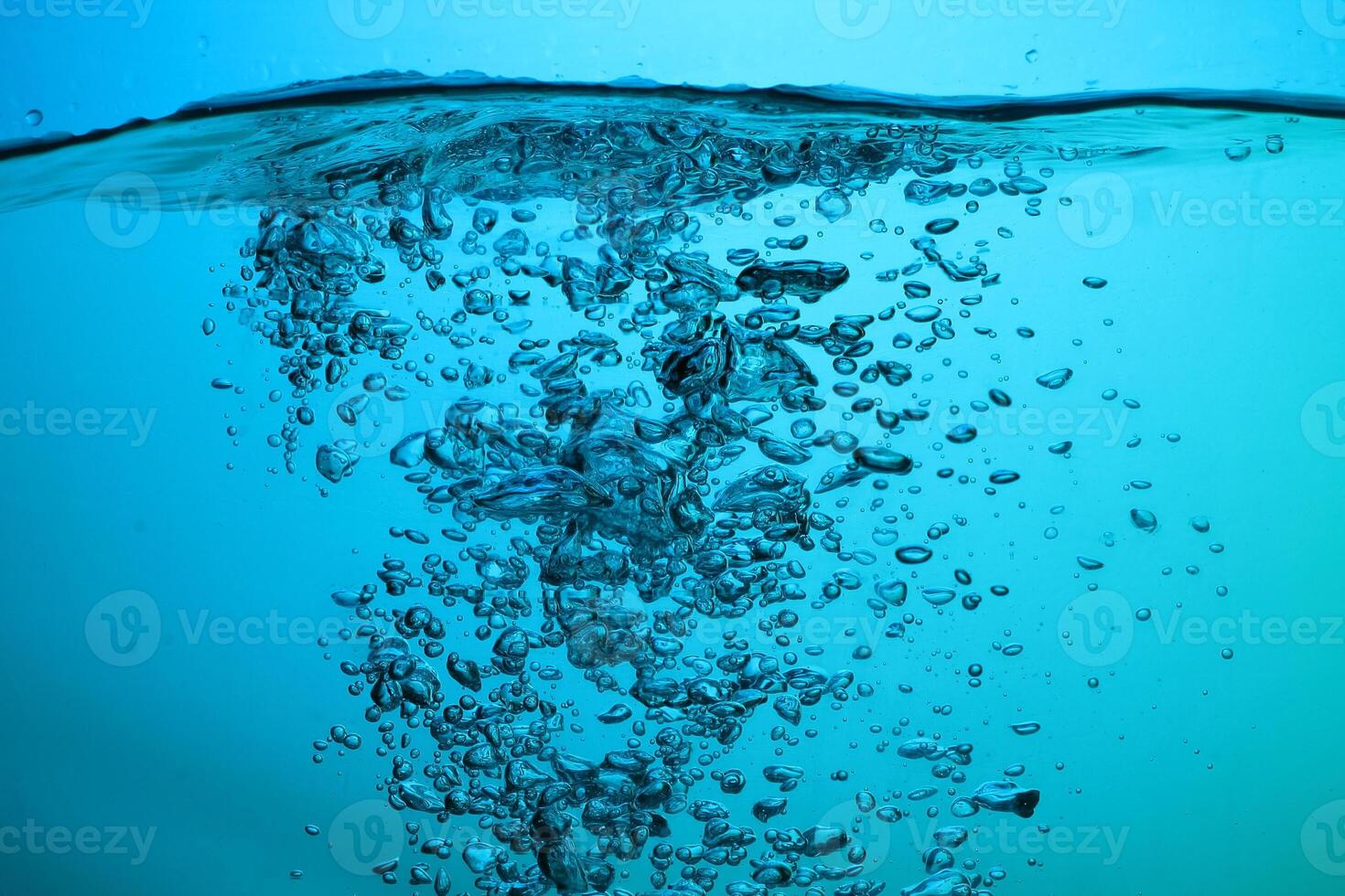 Fresh Water With Underwater Bubbles Texture on a Blue Background Close-up Abstract Liquid Bubbles Aqua Design Wallpaper photo