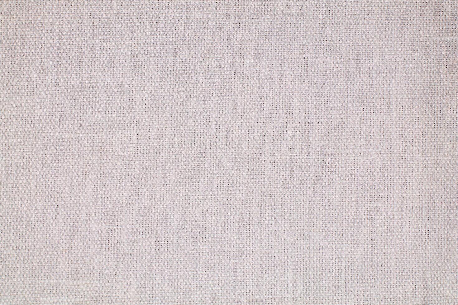 Natural Linen Material Textile Canvas Fabric Texture Background Close-up Detail of Fabric Natural Color Hemp Material Pattern Design Wallpaper. Can be Used as Background or For Graphic Design photo