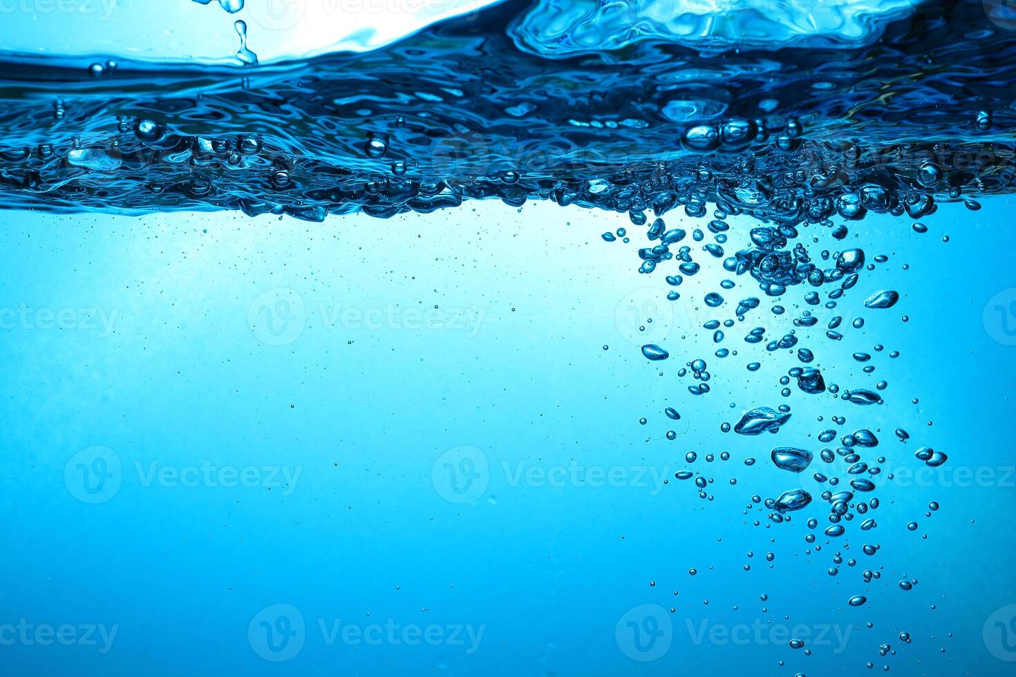 Fresh Water With Underwater Bubbles Texture on a Blue Background Close-up Abstract Liquid Bubbles Aqua Design Wallpaper photo