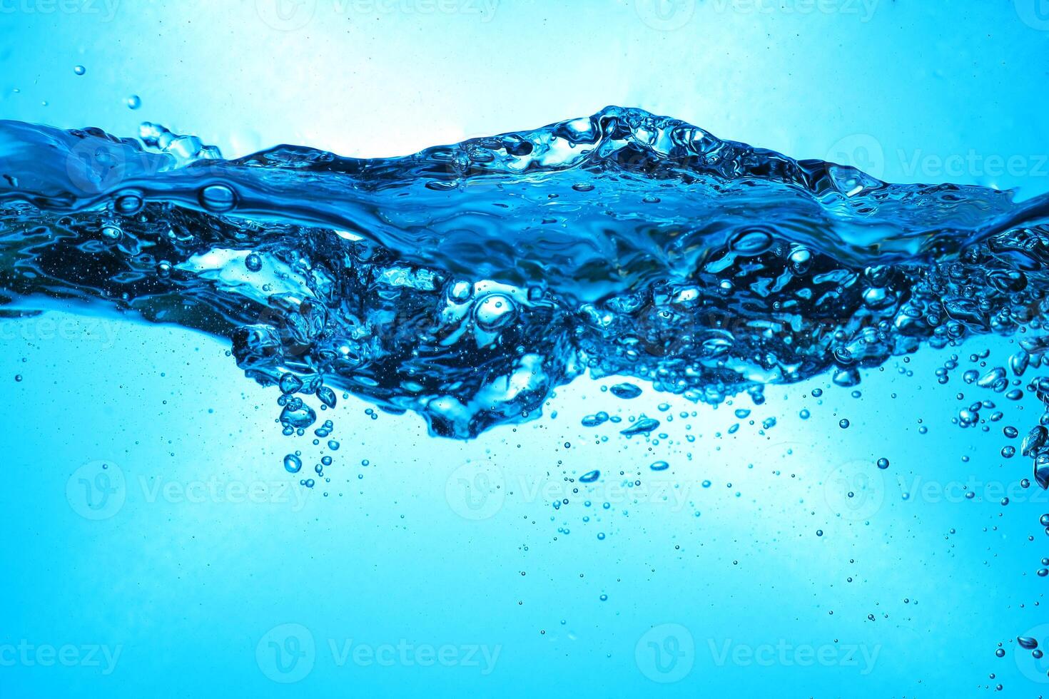 Fresh Water With Underwater Bubbles Texture on a Blue Background Close-up Abstract Liquid Bubbles Aqua Design Wallpaper photo