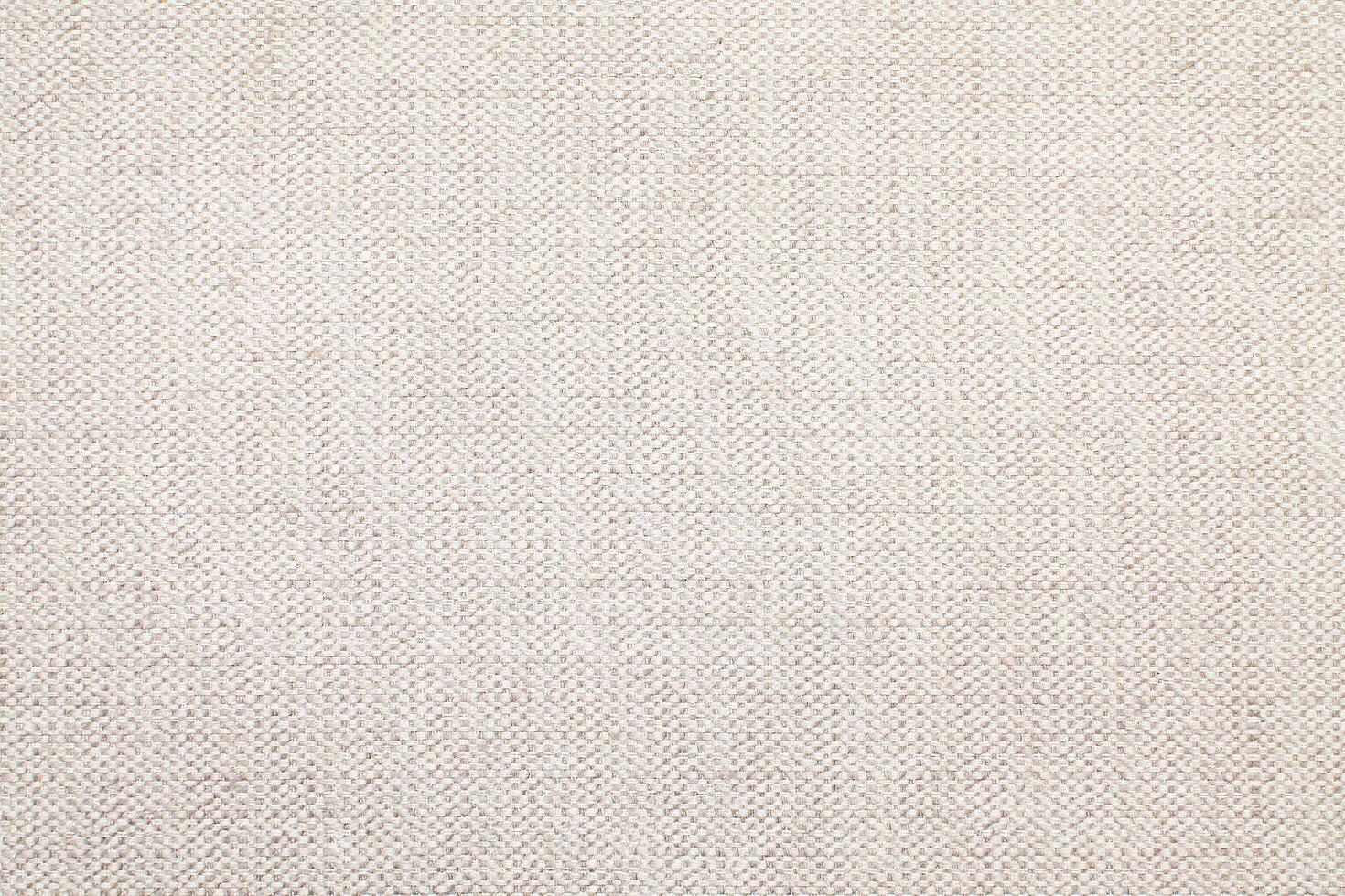 Natural Linen Material Textile Canvas Fabric Texture Background Close-up Detail of Fabric Natural Color Hemp Material Pattern Design Wallpaper. Can be Used as Background or For Graphic Design photo