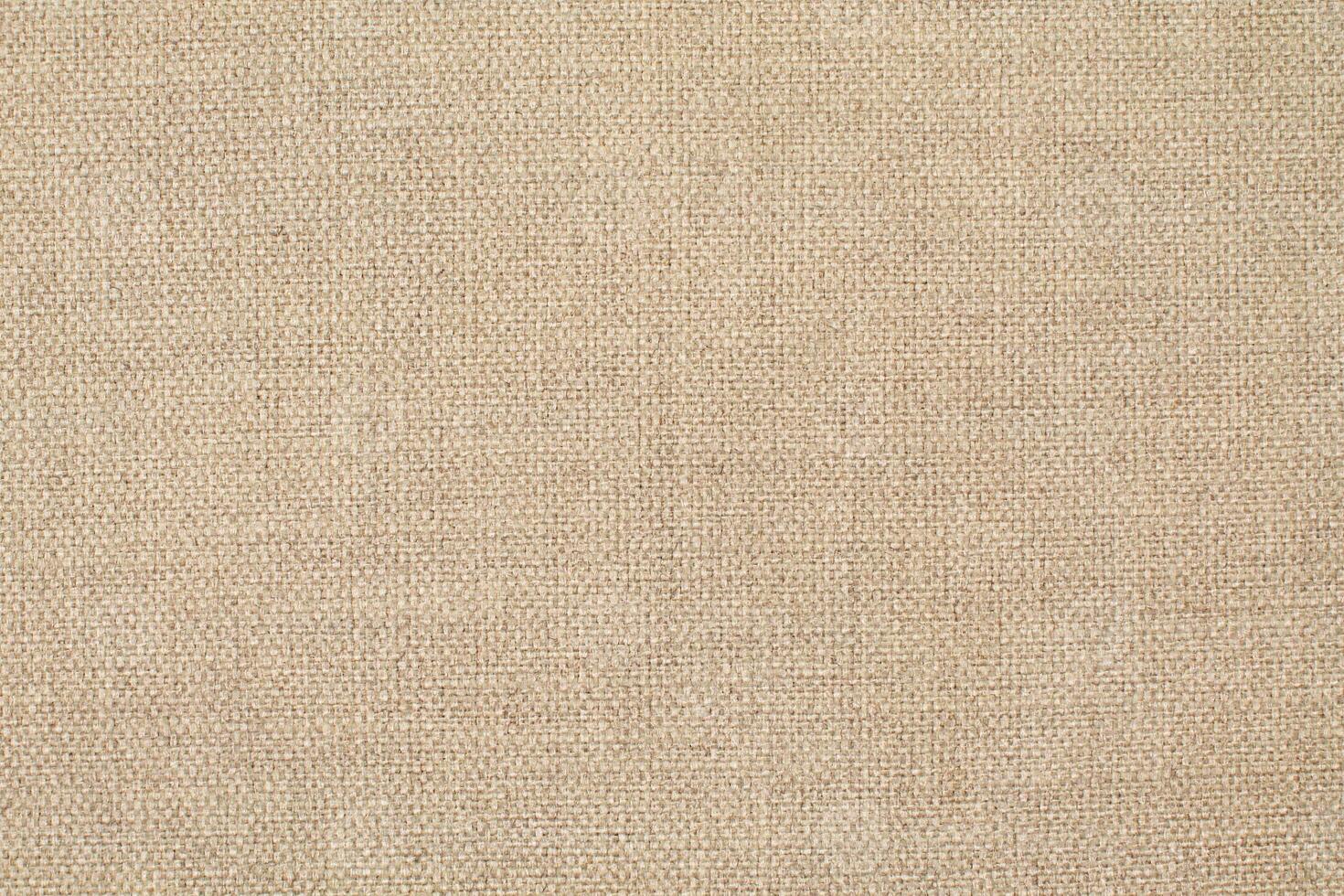 Natural Linen Material Textile Canvas Fabric Texture Background Close-up Detail of Fabric Natural Color Hemp Material Pattern Design Wallpaper. Can be Used as Background or For Graphic Design photo