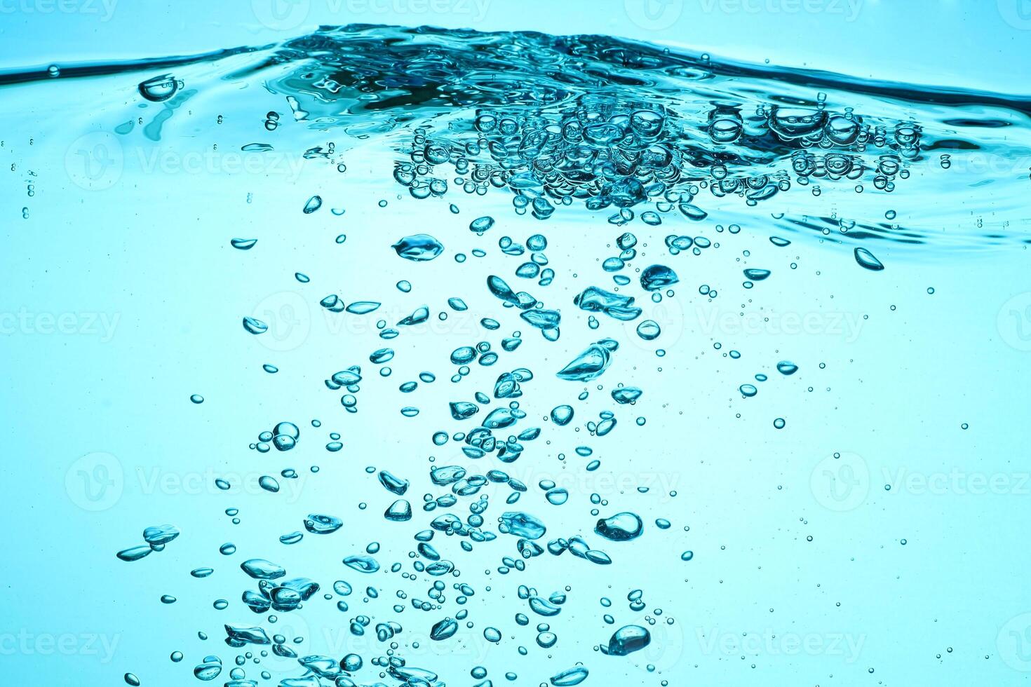 Fresh Water With Underwater Bubbles Texture on a Blue Background Close-up Abstract Liquid Bubbles Aqua Design Wallpaper photo