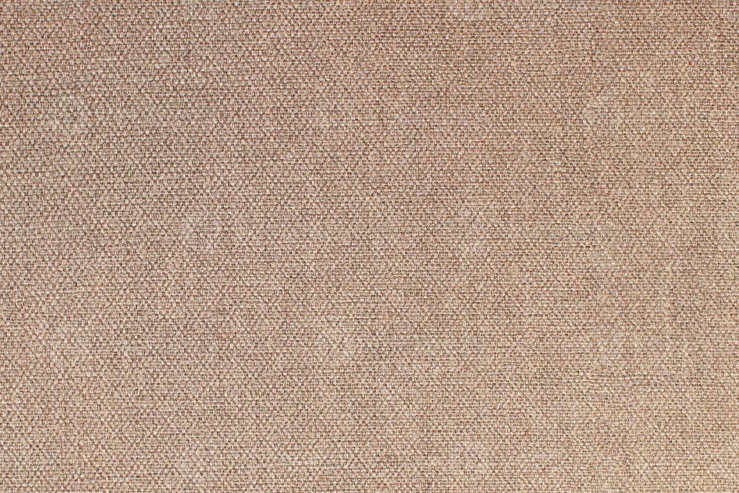 Natural Linen Material Textile Canvas Fabric Texture Background Close-up Detail of Fabric Natural Color Hemp Material Pattern Design Wallpaper. Can be Used as Background or For Graphic Design photo