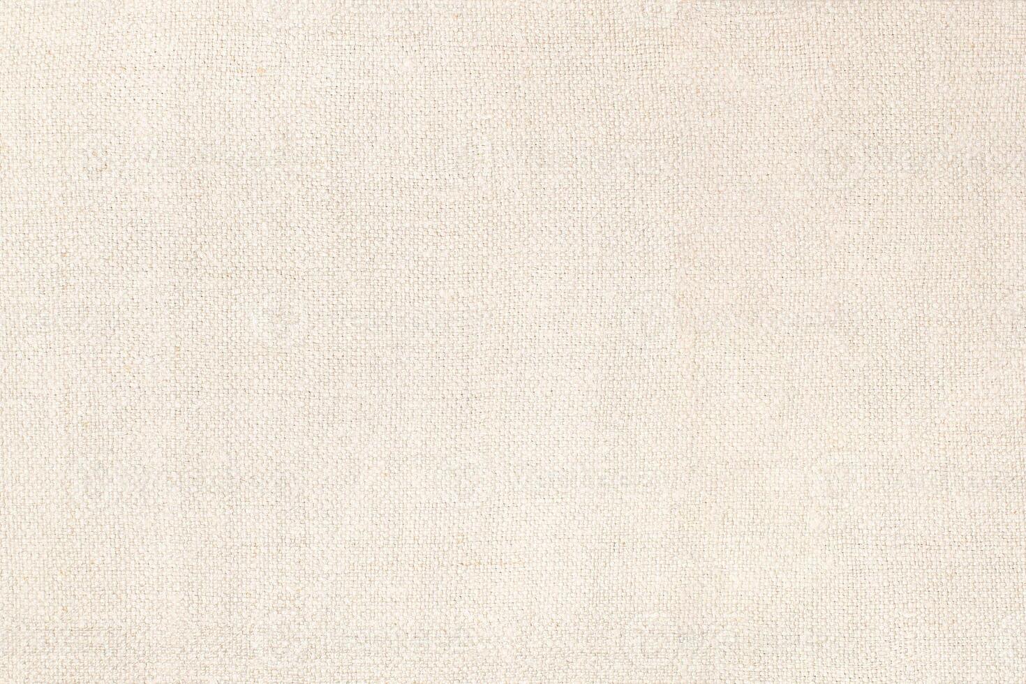 Natural Linen Material Textile Canvas Fabric Texture Background Close-up Detail of Fabric Natural Color Hemp Material Pattern Design Wallpaper. Can be Used as Background or For Graphic Design photo