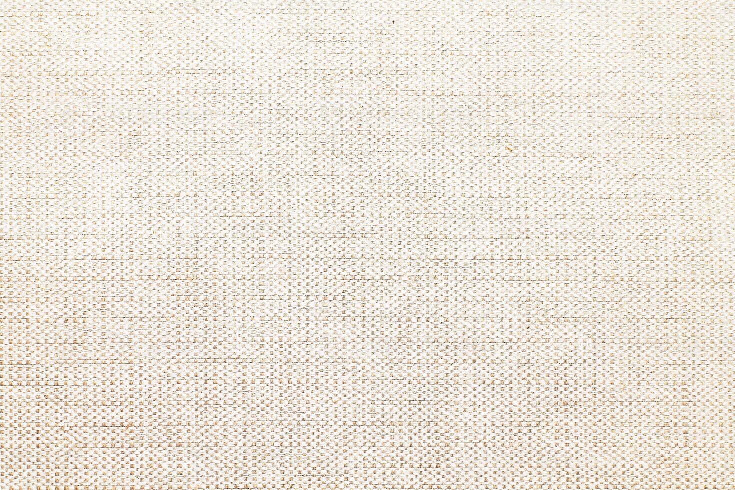 Natural Linen Material Textile Canvas Fabric Texture Background Close-up Detail of Fabric Natural Color Hemp Material Pattern Design Wallpaper. Can be Used as Background or For Graphic Design photo