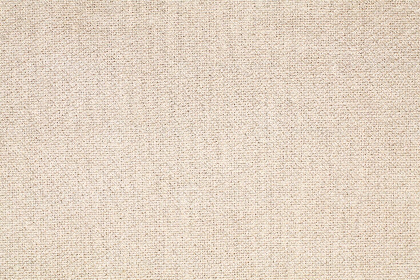 Natural Linen Material Textile Canvas Fabric Texture Background Close-up Detail of Fabric Natural Color Hemp Material Pattern Design Wallpaper. Can be Used as Background or For Graphic Design photo