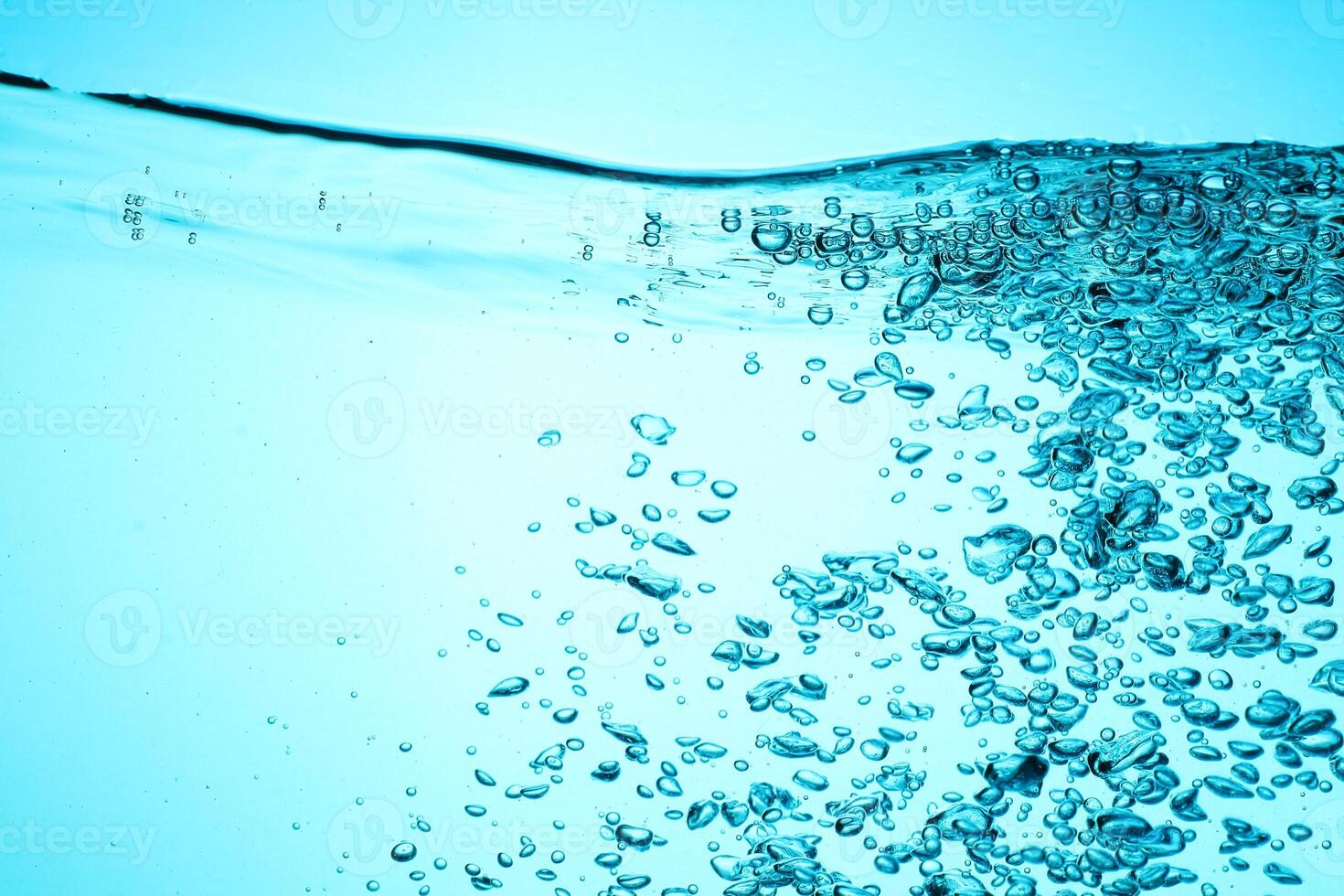 Fresh Water With Underwater Bubbles Texture on a Blue Background Close-up Abstract Liquid Bubbles Aqua Design Wallpaper photo