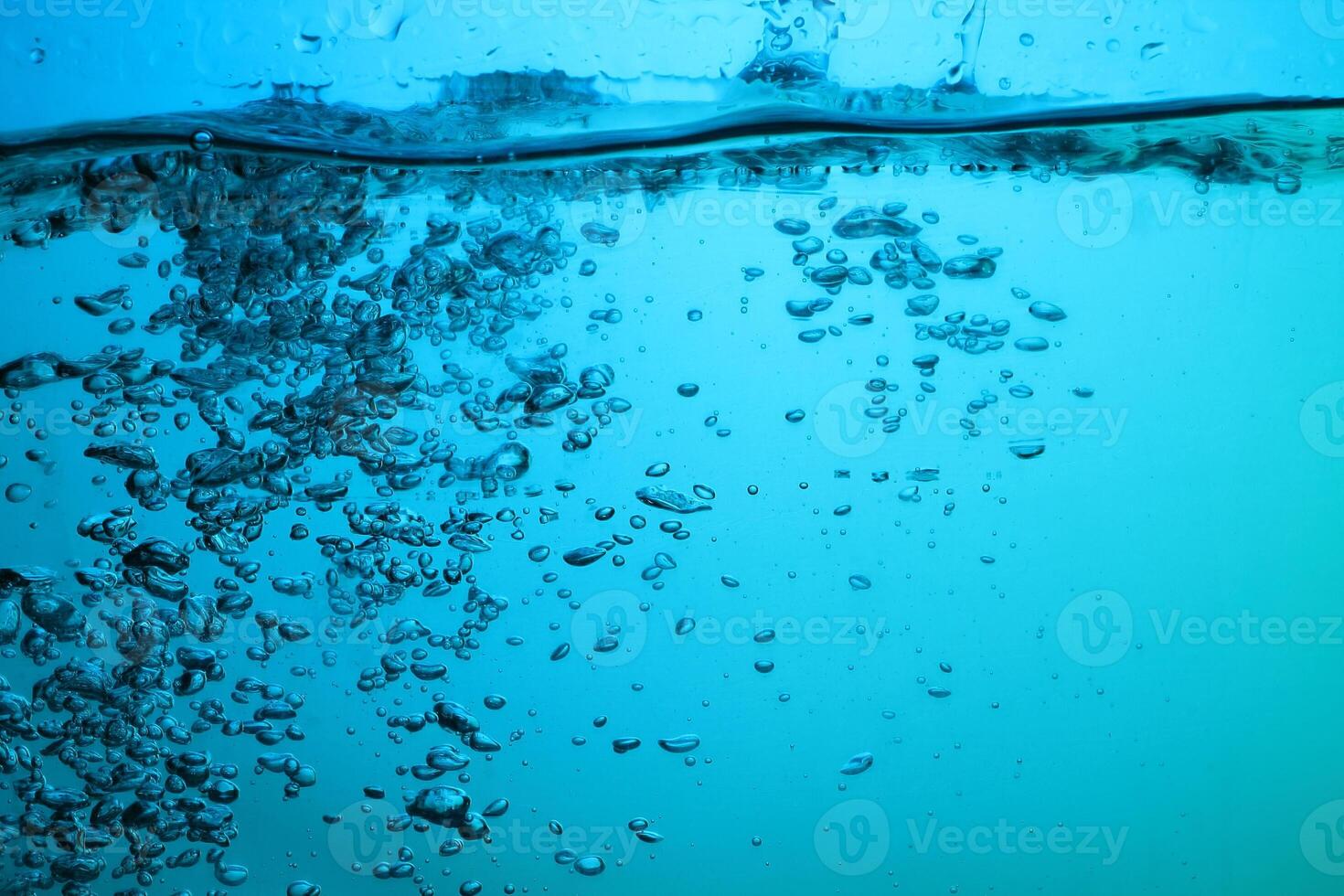 Fresh Water With Underwater Bubbles Texture on a Blue Background Close-up Abstract Liquid Bubbles Aqua Design Wallpaper photo
