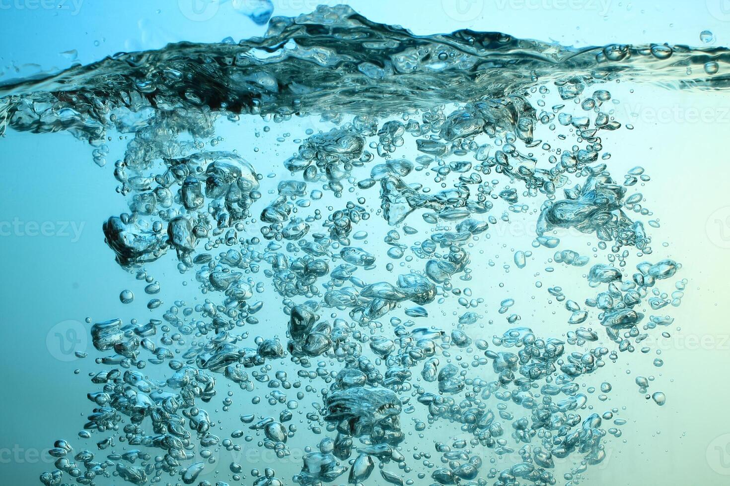 Fresh Water With Underwater Bubbles Texture on a Blue Background Close-up Abstract Liquid Bubbles Aqua Design Wallpaper photo