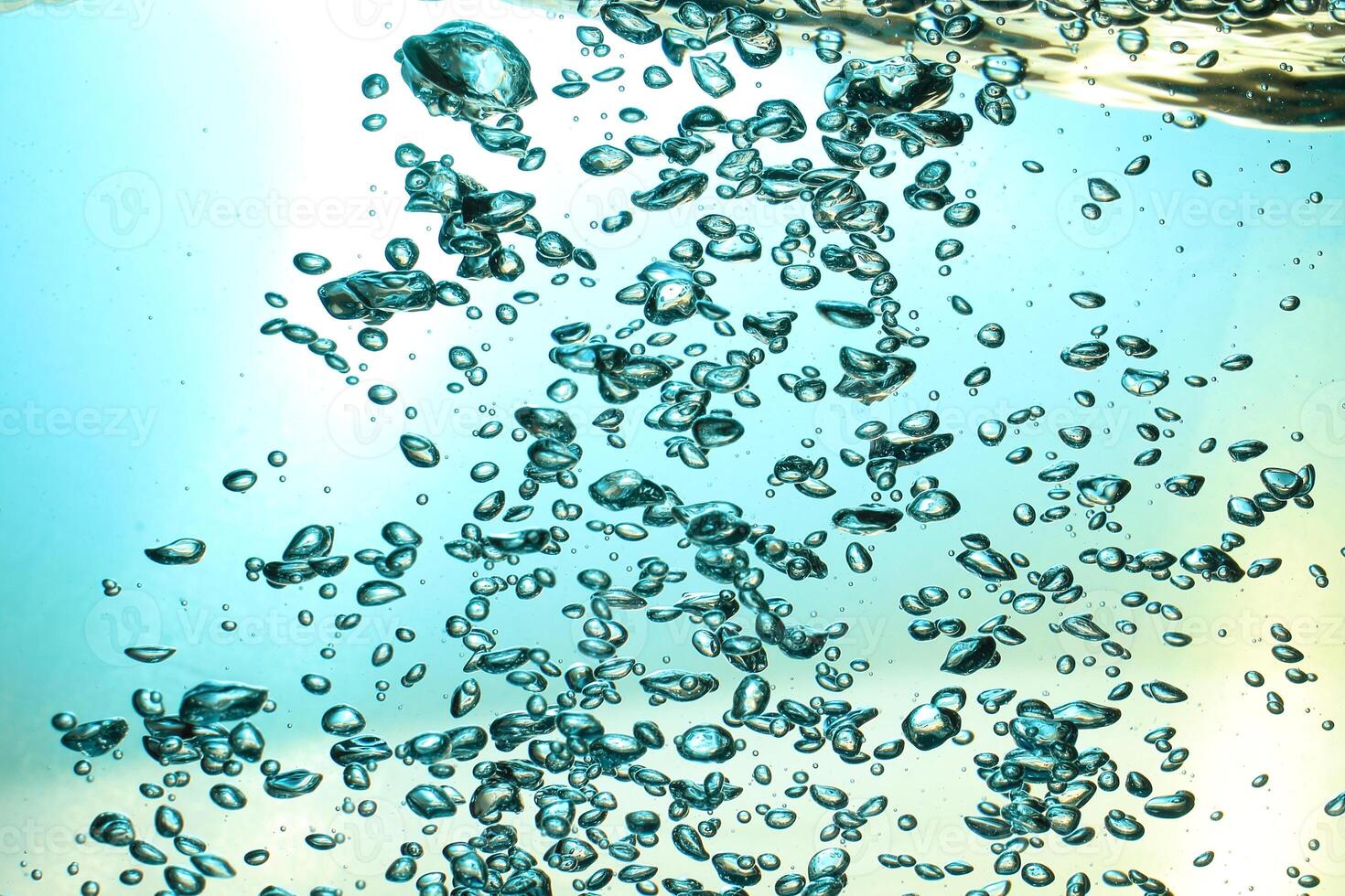 Fresh Water With Underwater Bubbles Texture on a Blue Background Close-up Abstract Liquid Bubbles Aqua Design Wallpaper photo