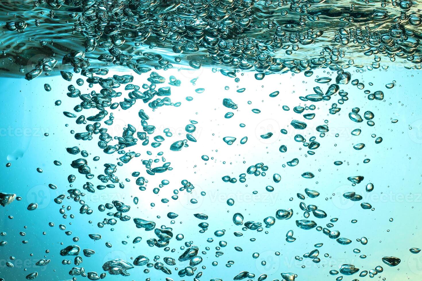 Fresh Water With Underwater Bubbles Texture on a Blue Background Close-up Abstract Liquid Bubbles Aqua Design Wallpaper photo