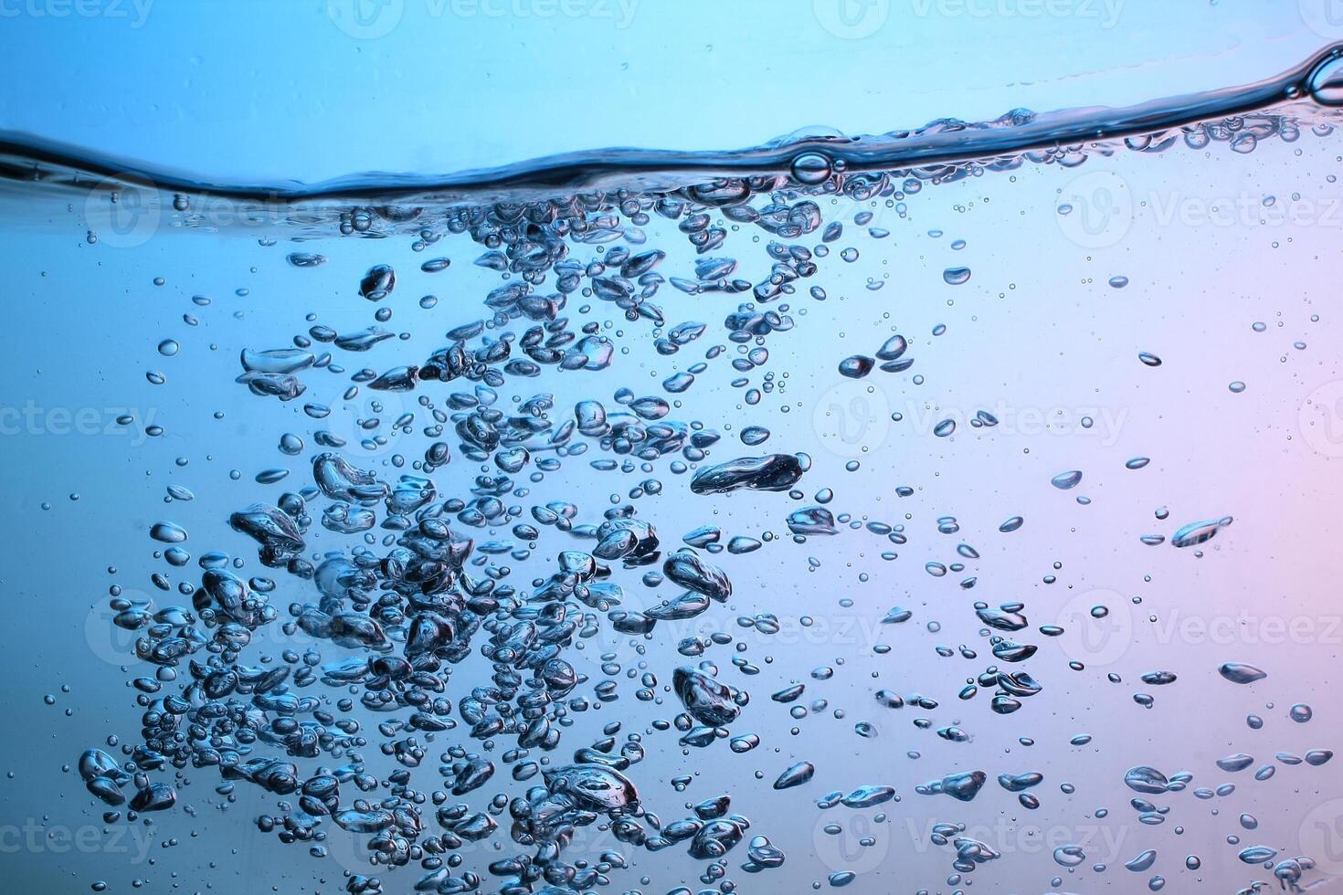 Fresh Water With Underwater Bubbles Texture on a Blue Background Close-up Abstract Liquid Bubbles Aqua Design Wallpaper photo