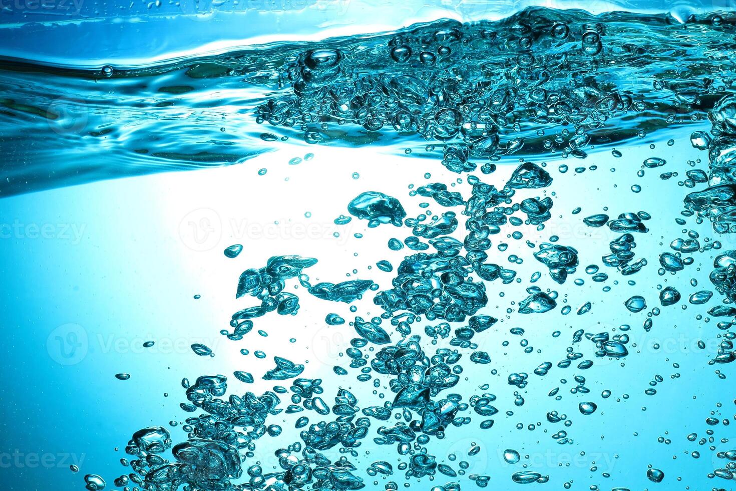Fresh Water With Underwater Bubbles Texture on a Blue Background Close-up Abstract Liquid Bubbles Aqua Design Wallpaper photo