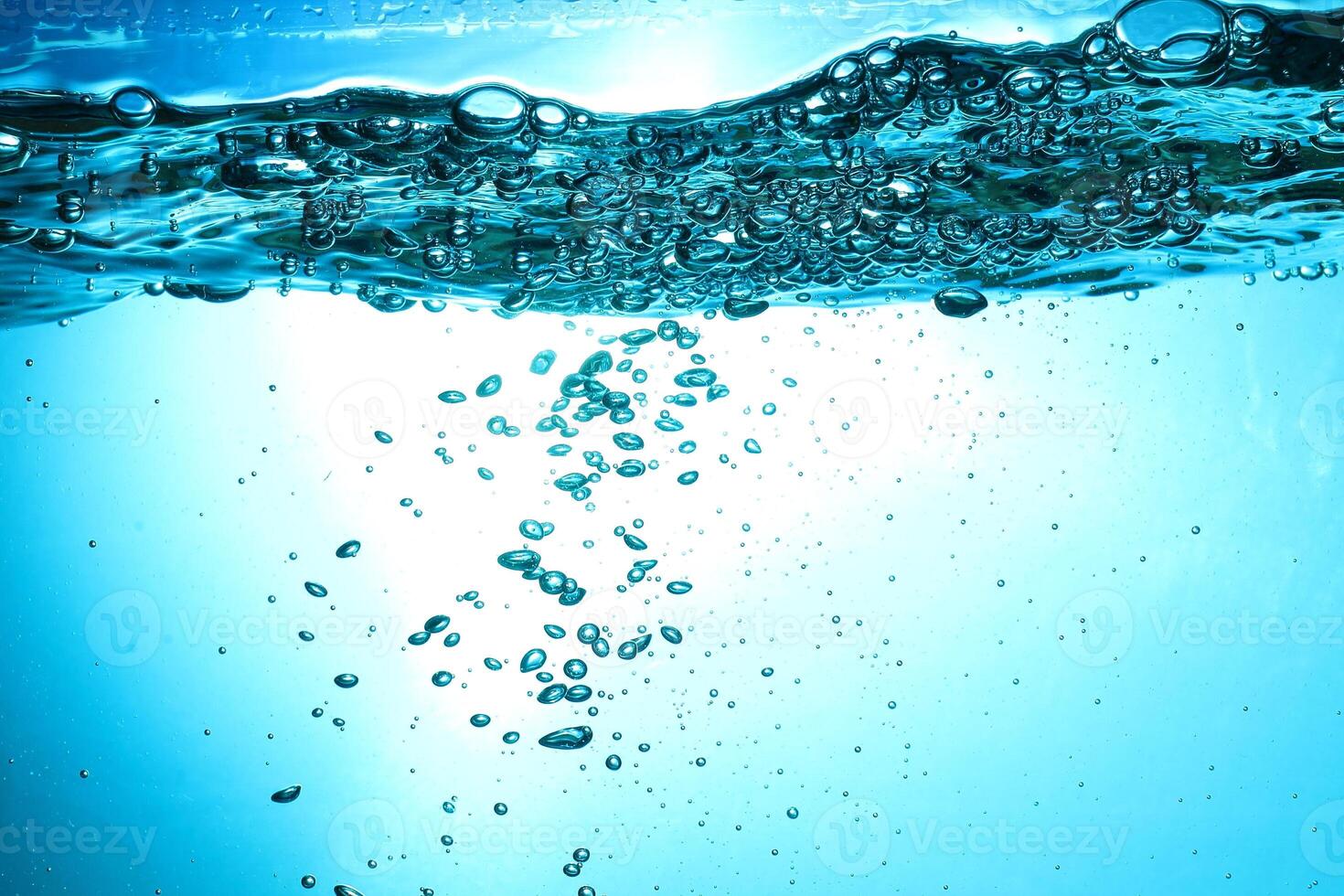 Fresh Water With Underwater Bubbles Texture on a Blue Background Close-up Abstract Liquid Bubbles Aqua Design Wallpaper photo