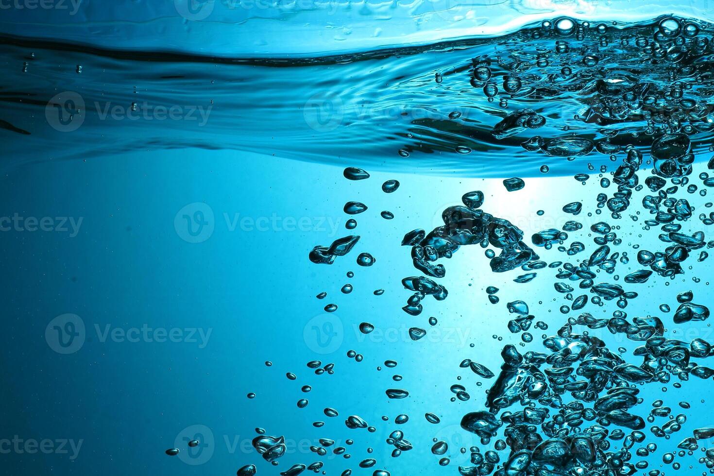 Fresh Water With Underwater Bubbles Texture on a Blue Background Close-up Abstract Liquid Bubbles Aqua Design Wallpaper photo