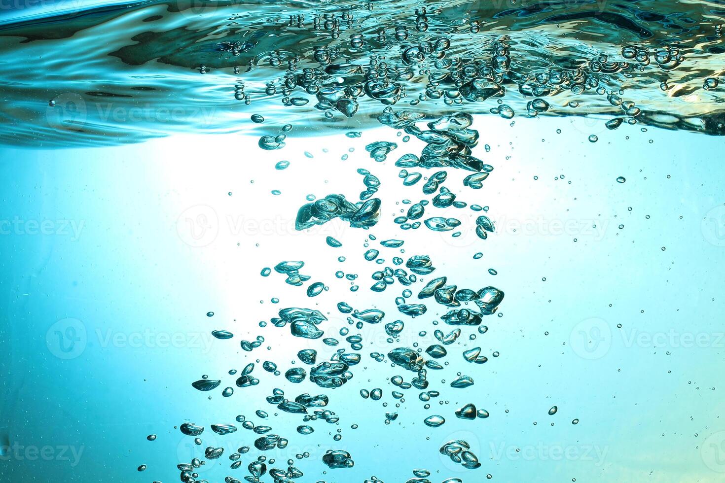 Fresh Water With Underwater Bubbles Texture on a Blue Background Close-up Abstract Liquid Bubbles Aqua Design Wallpaper photo