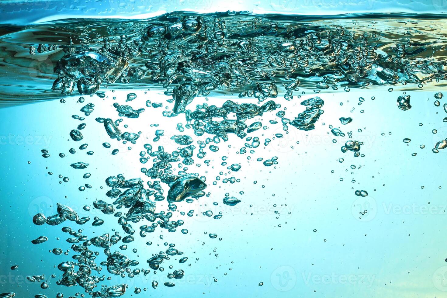 Fresh Water With Underwater Bubbles Texture on a Blue Background Close-up Abstract Liquid Bubbles Aqua Design Wallpaper photo