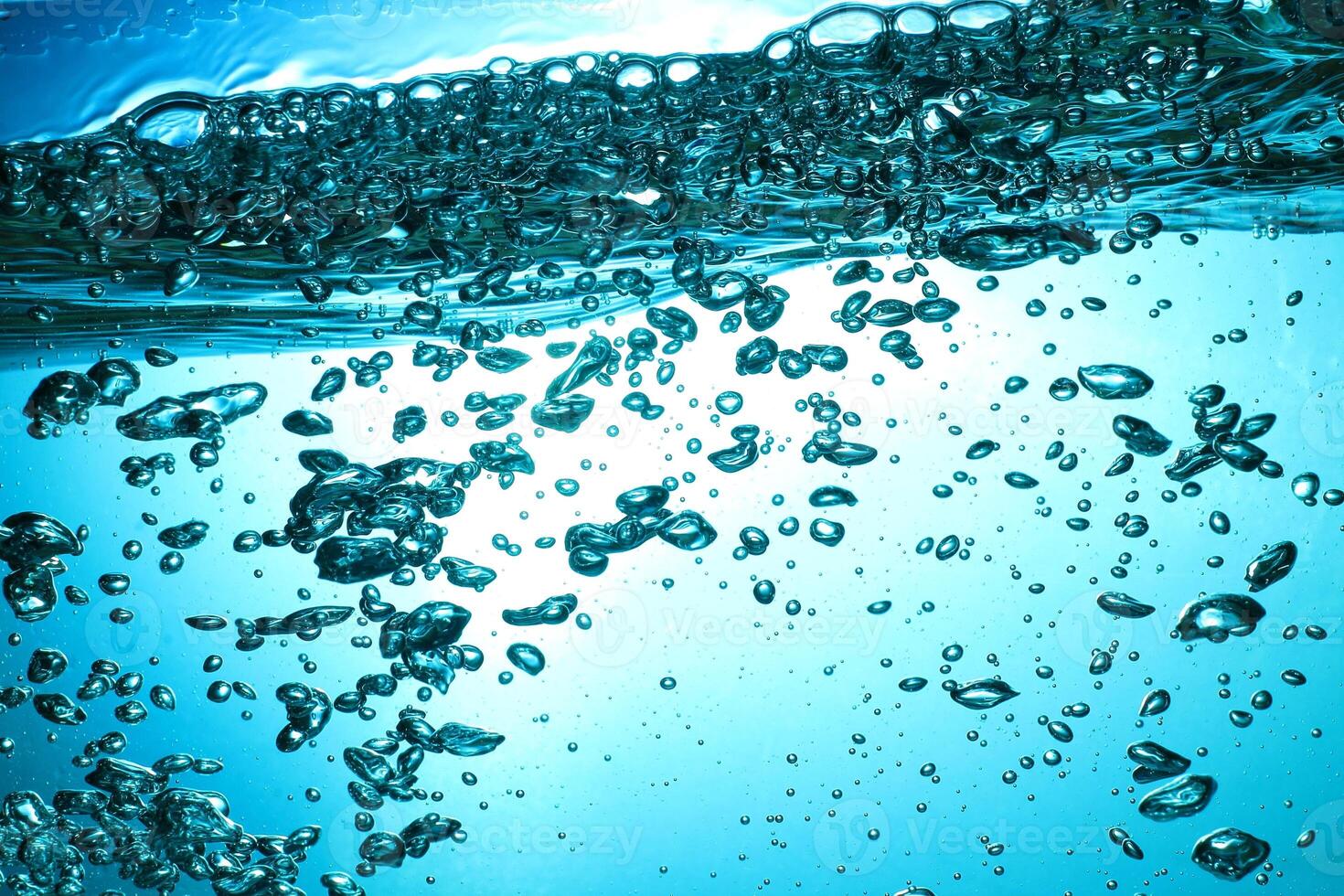 Fresh Water With Underwater Bubbles Texture on a Blue Background Close-up Abstract Liquid Bubbles Aqua Design Wallpaper photo