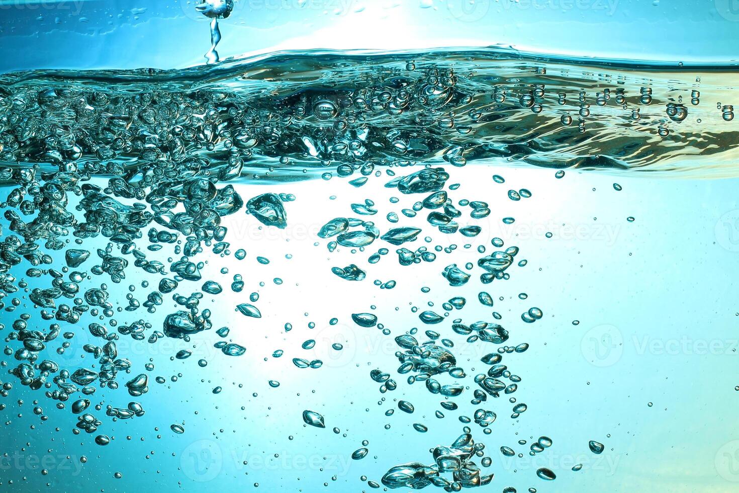 Fresh Water With Underwater Bubbles Texture on a Blue Background Close-up Abstract Liquid Bubbles Aqua Design Wallpaper photo